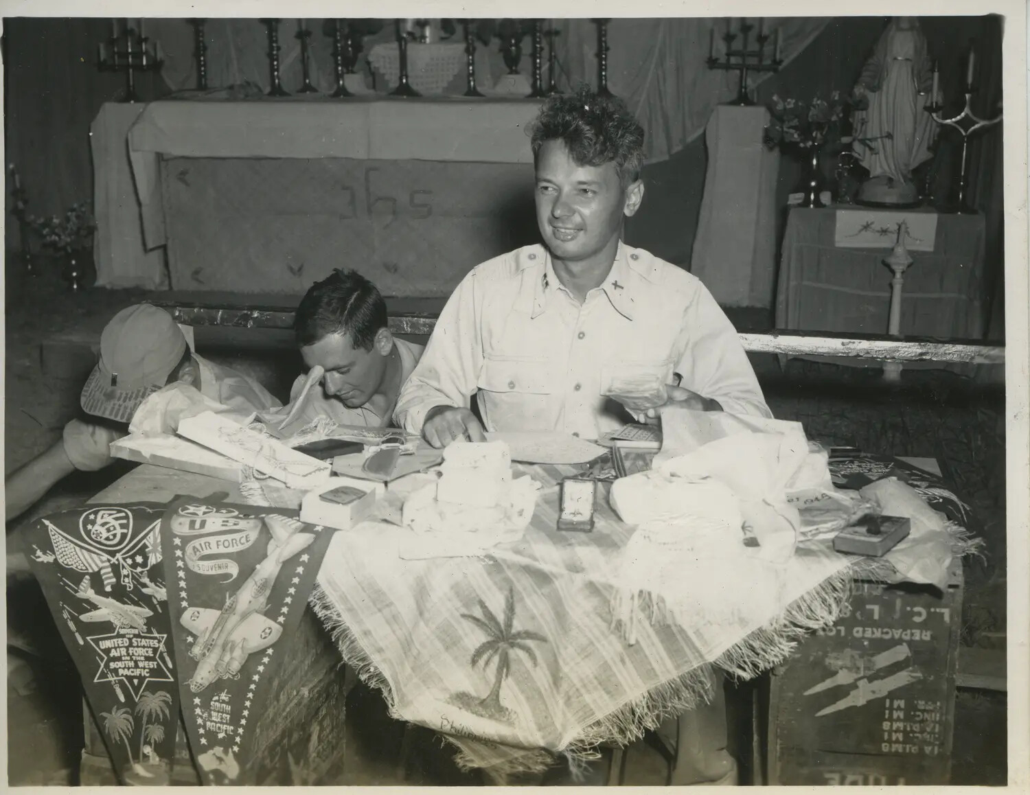 Servicemen with Souvenir Pennants and Devotional Items Inside Field Chapel, Philippines