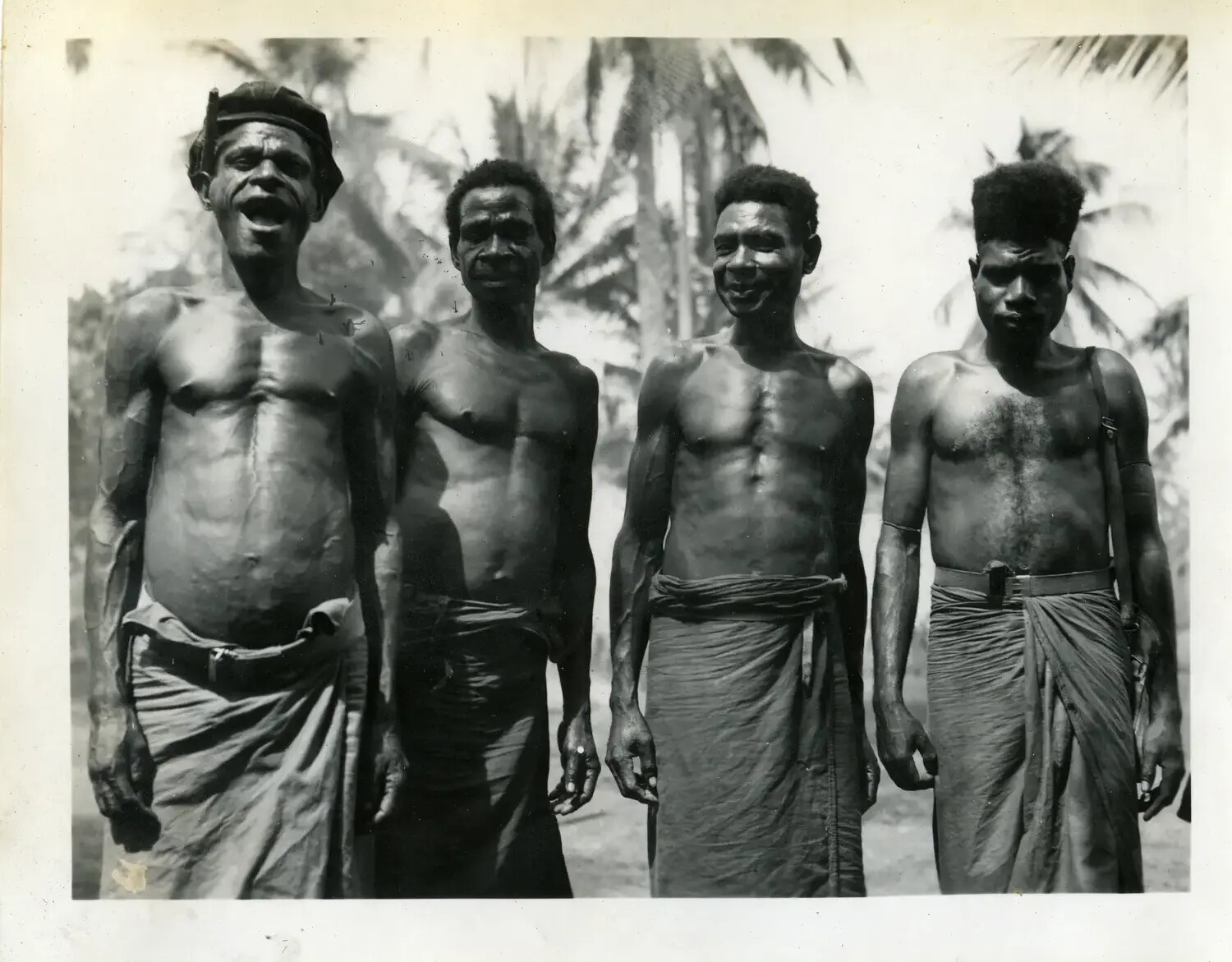 Group Portrait of Four Local Men, New Guinea, 312th Bombardment Group Collection, WWII