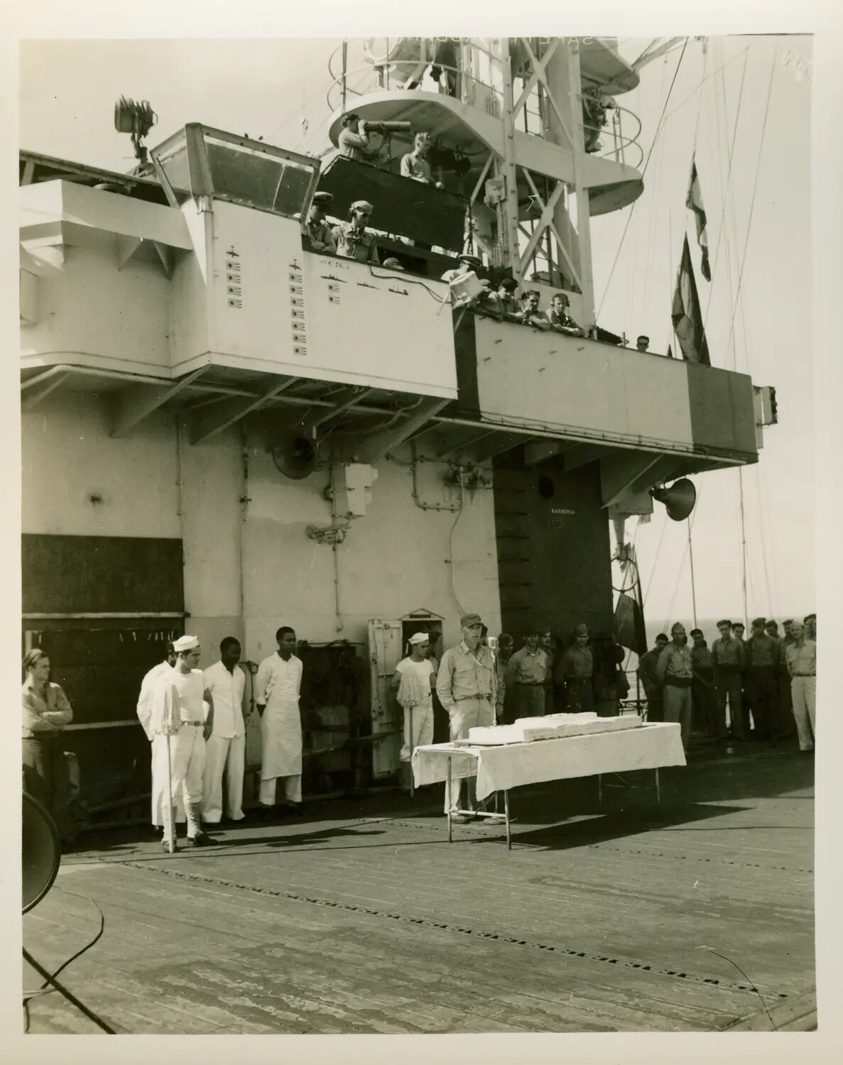Ceremony and Cake Presentation on Flight Deck, USS Petrof Bay (CVE-80)