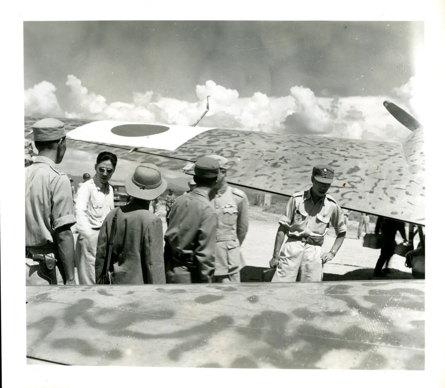 Japanese Military Personnel Beneath Aircraft Wing with Hinomaru Insignia, China-Burma Theater, WWII