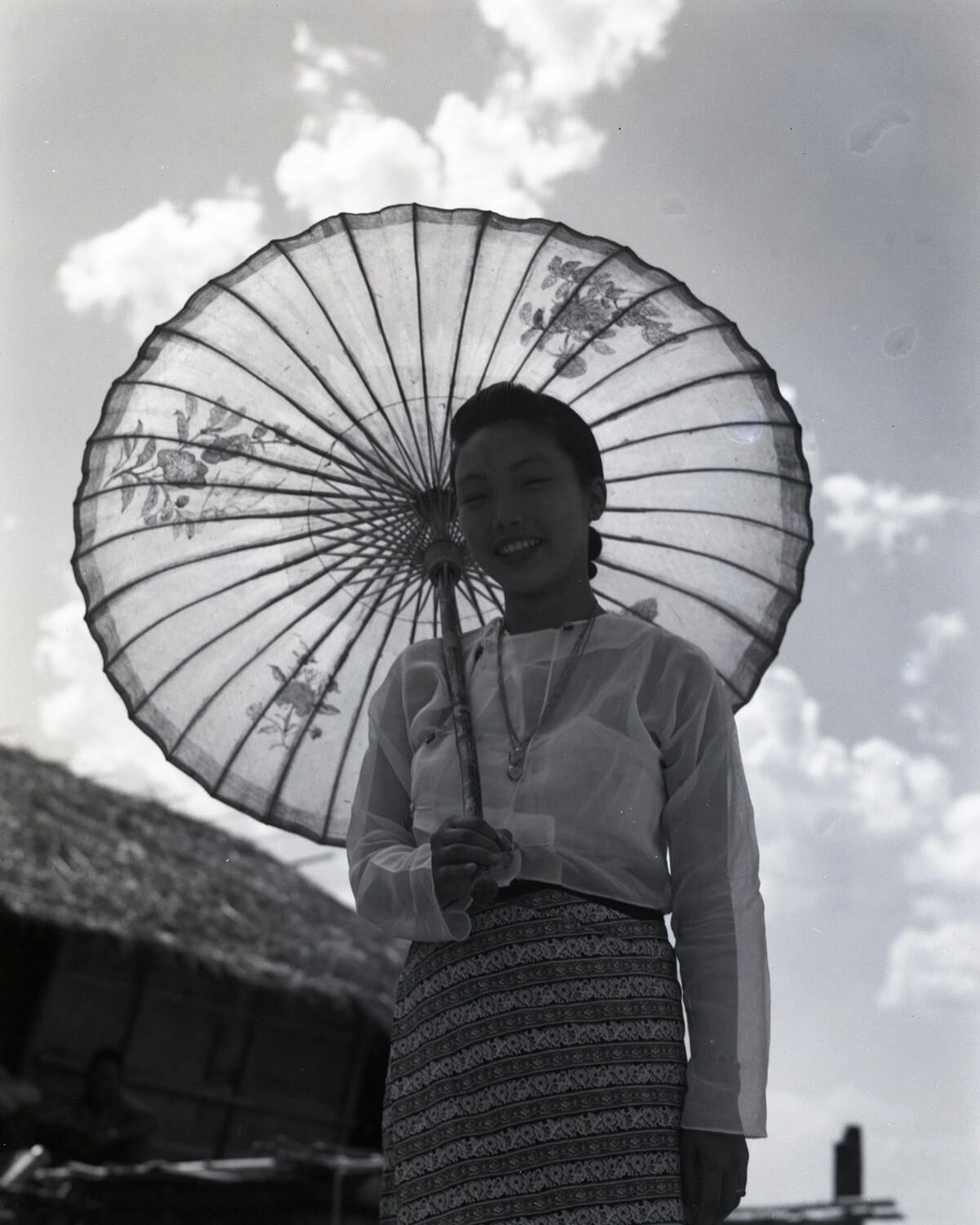 Portrait of a Young Karen Woman with a Traditional Paper Parasol, Burma, World War II Era