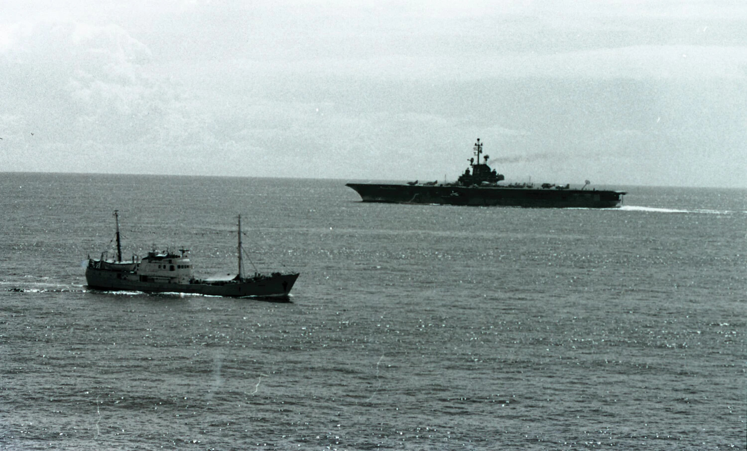 USS Ticonderoga Shadowed by Trawler at Sea, Vietnam War Era