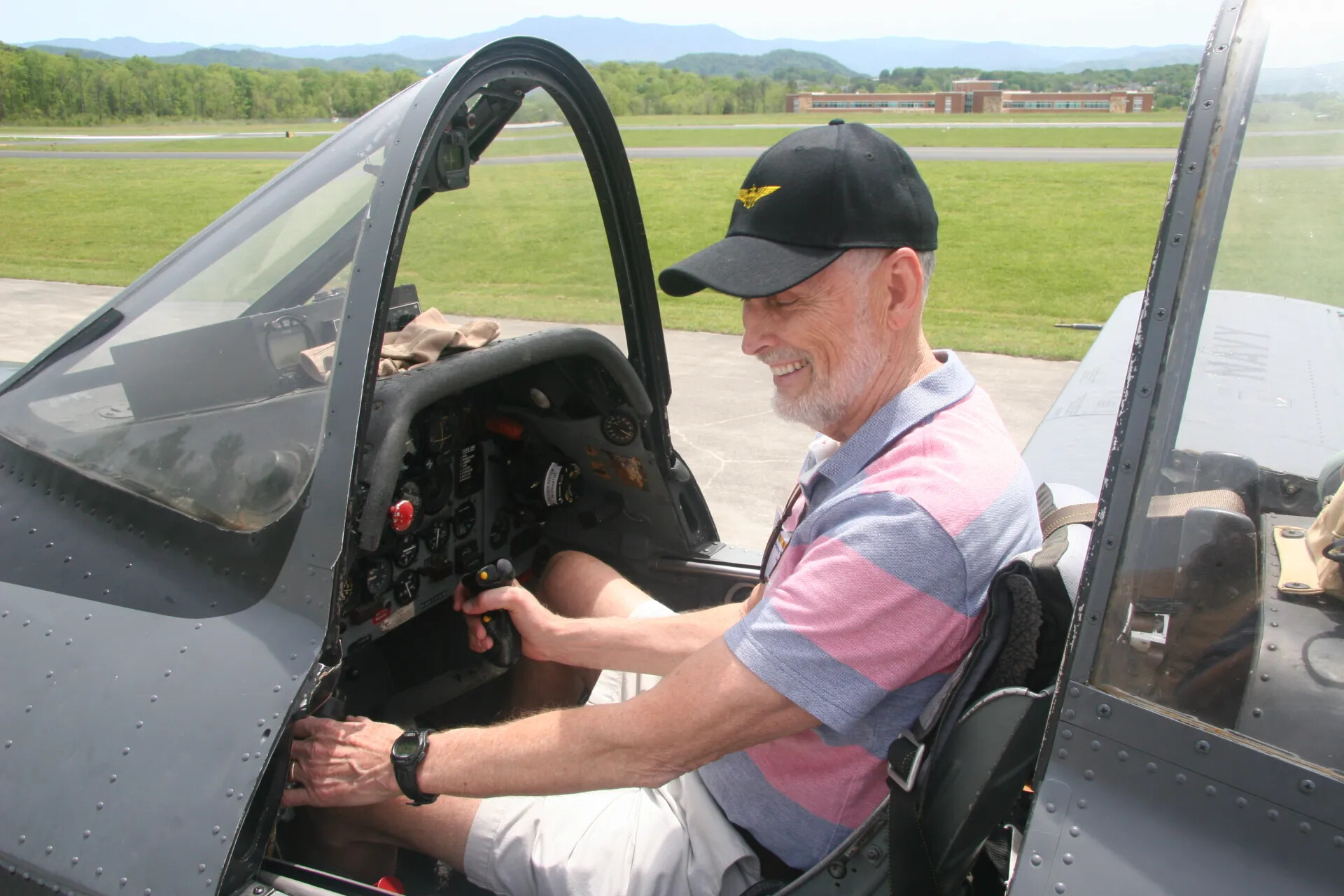 Veteran Seated in Vintage Aircraft Cockpit, Operation Tailwind Reunion Event, 2016