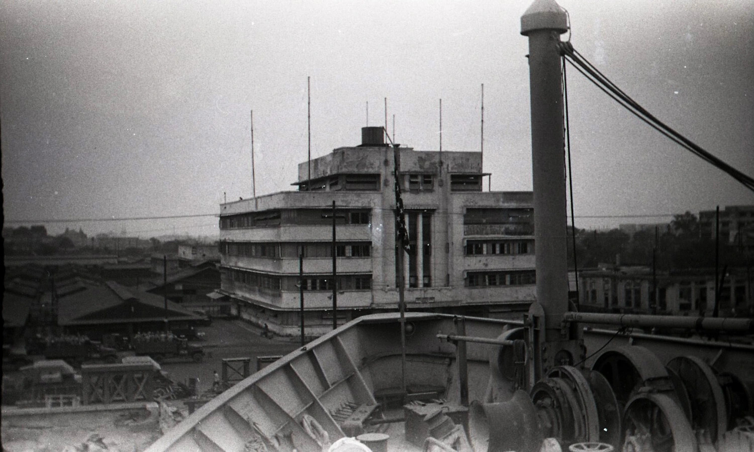 Shipboard View of Manila Waterfront and Art Deco Building from Cargo Vessel Deck, Philippines, 1945