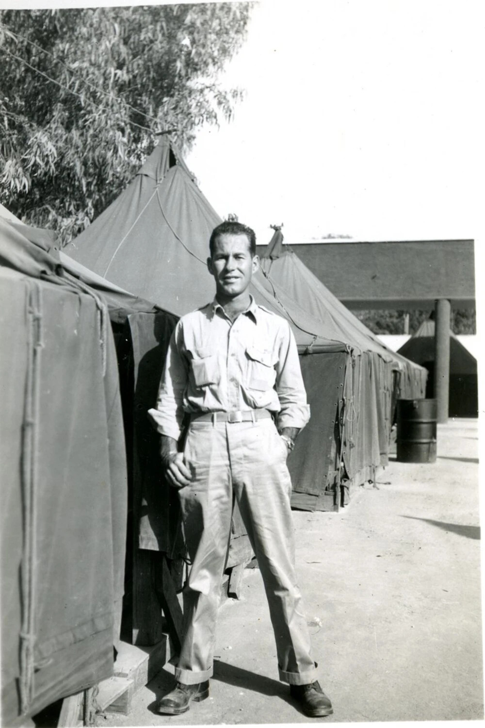 Serviceman Standing Before Squad Tents, CBI Theater Encampment