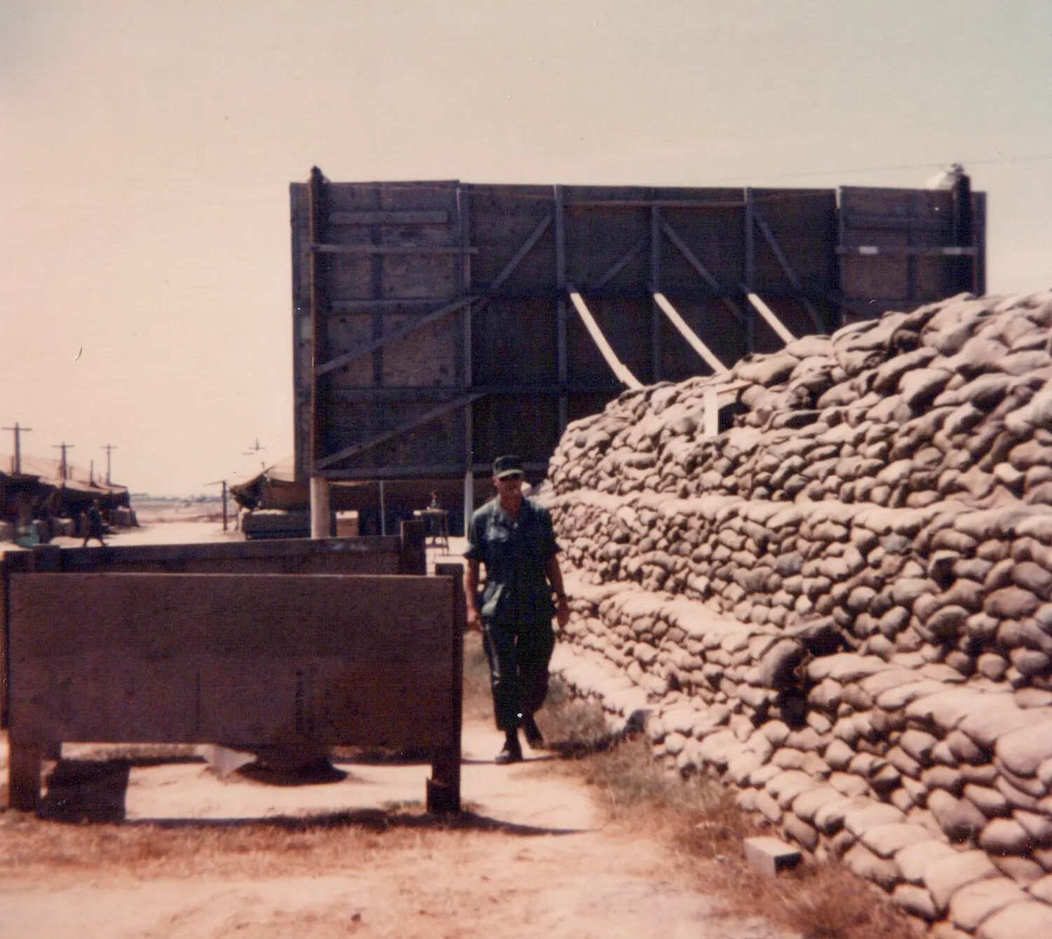 U.S. Serviceman Beside Sandbagged Bunker Complex, Cu Chi Base Camp, Vietnam, 1967
