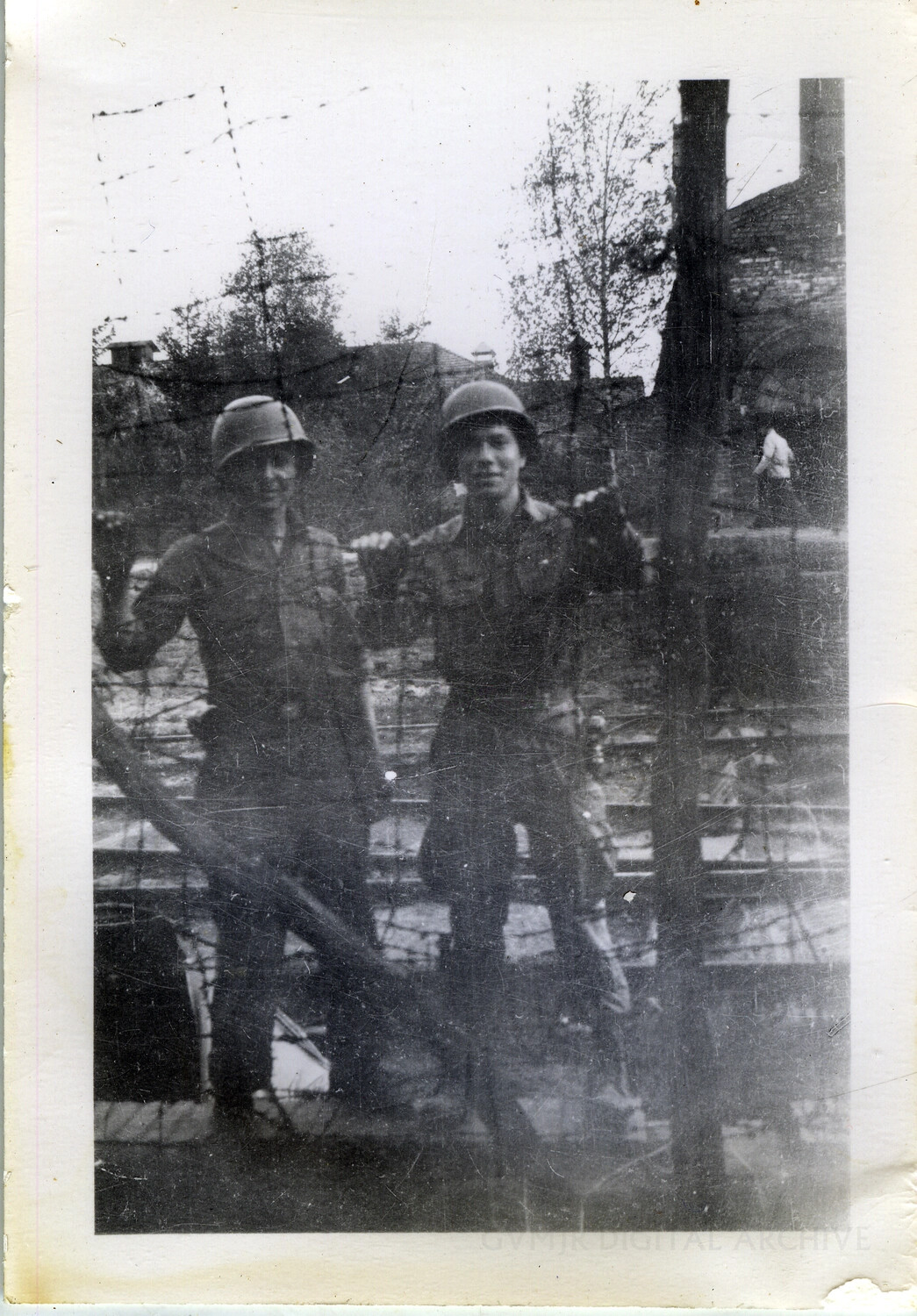 Two American Soldiers Posing at Barbed-Wire Camp Enclosure, Germany, 1945