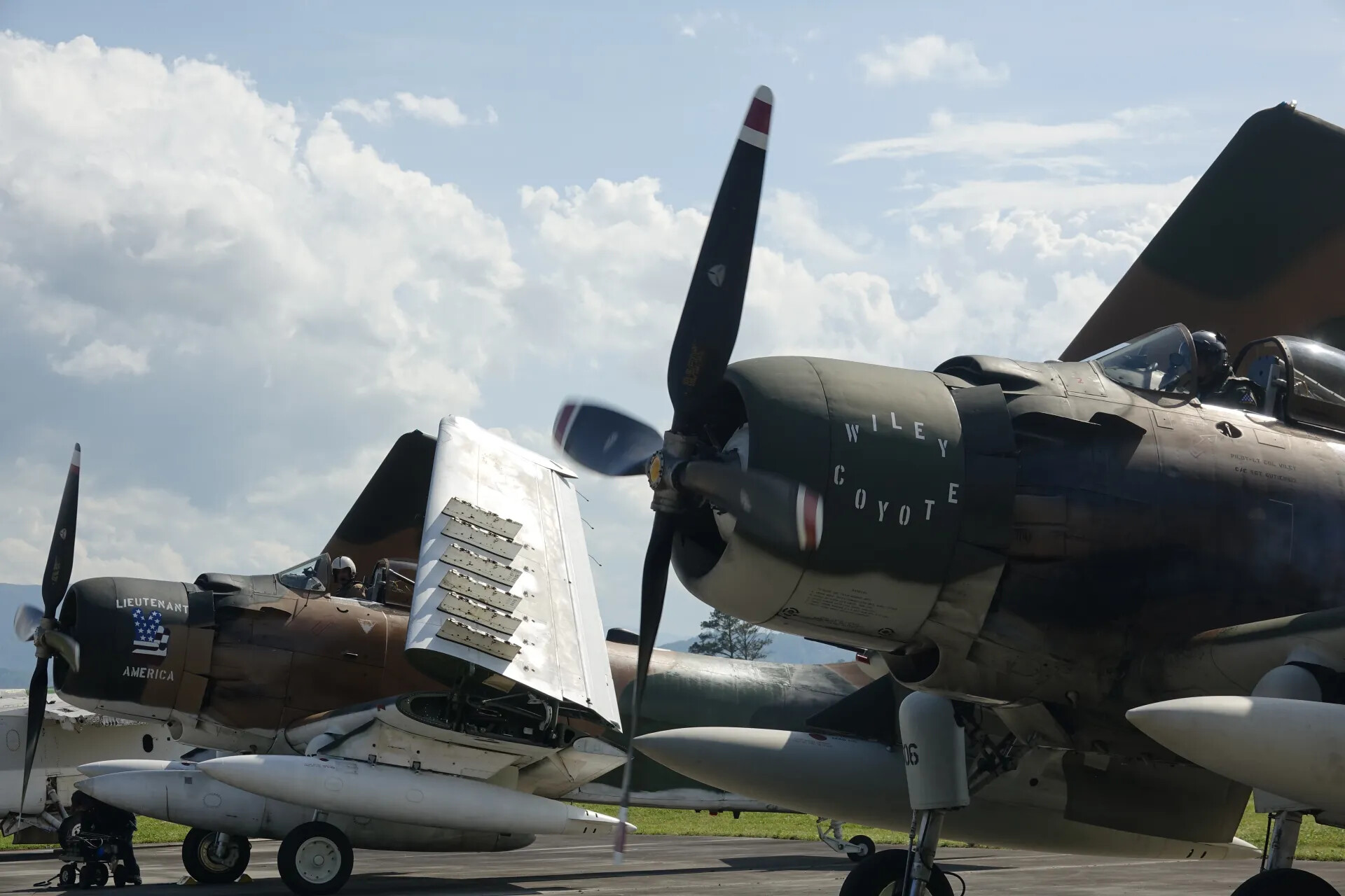A-1 Skyraiders 'Wiley Coyote' and 'Lieutenant America' Side by Side, Propellers Turning