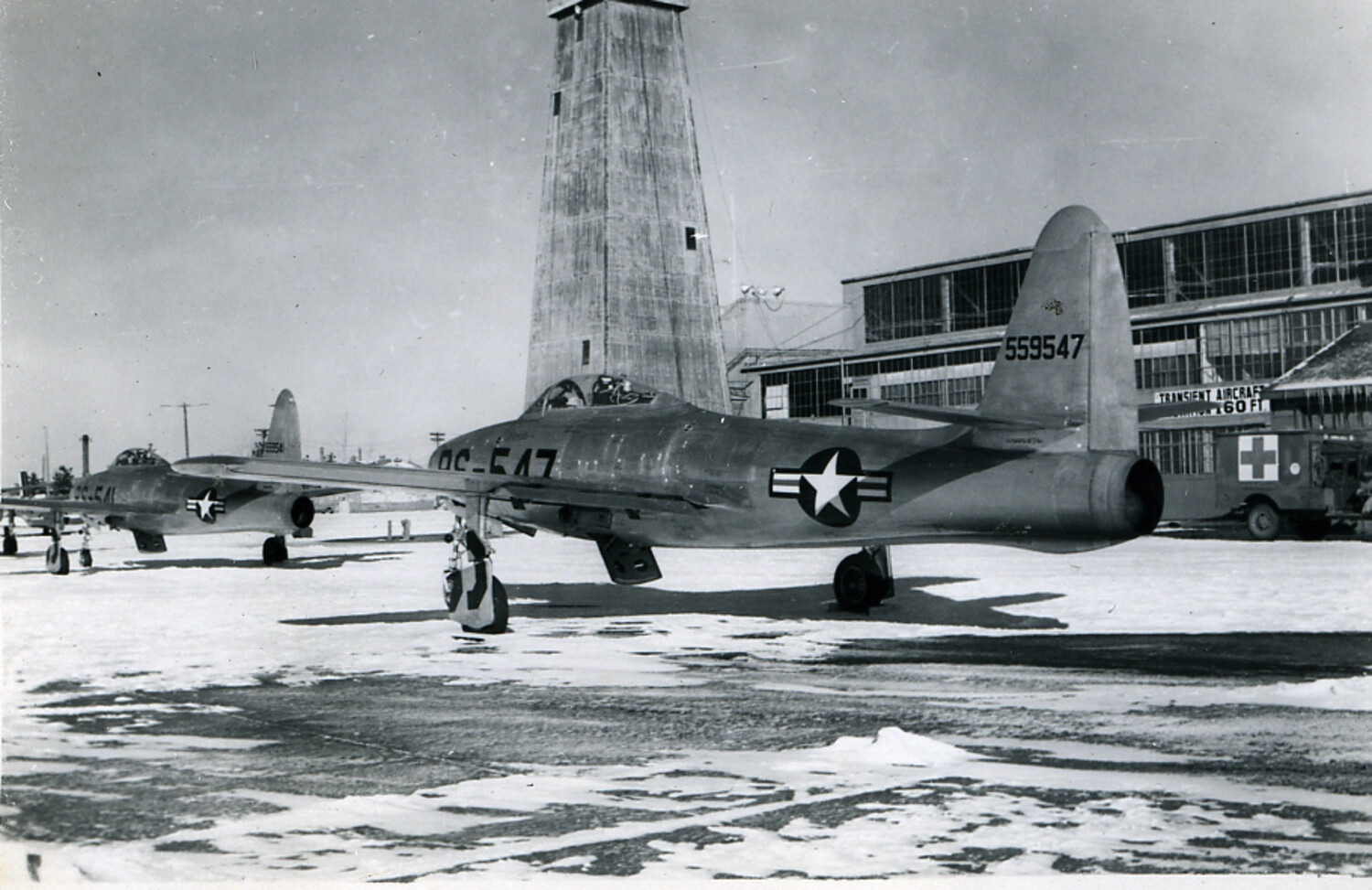 Republic F-84 Thunderjet Fighters on Snow-Covered Ramp, USAF Base, Early 1950s