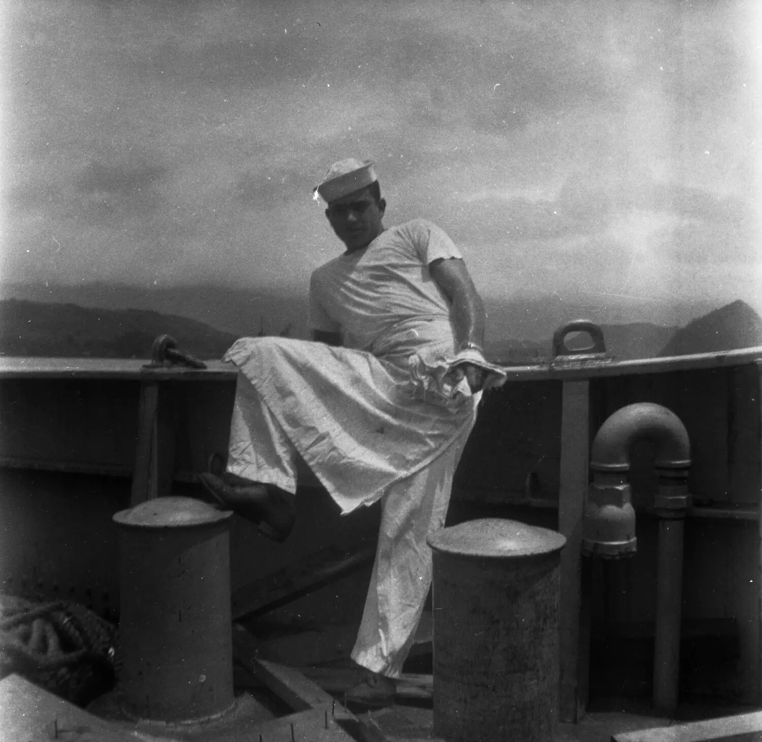 Sailor Posing on Ship's Railing, Sasebo, Japan