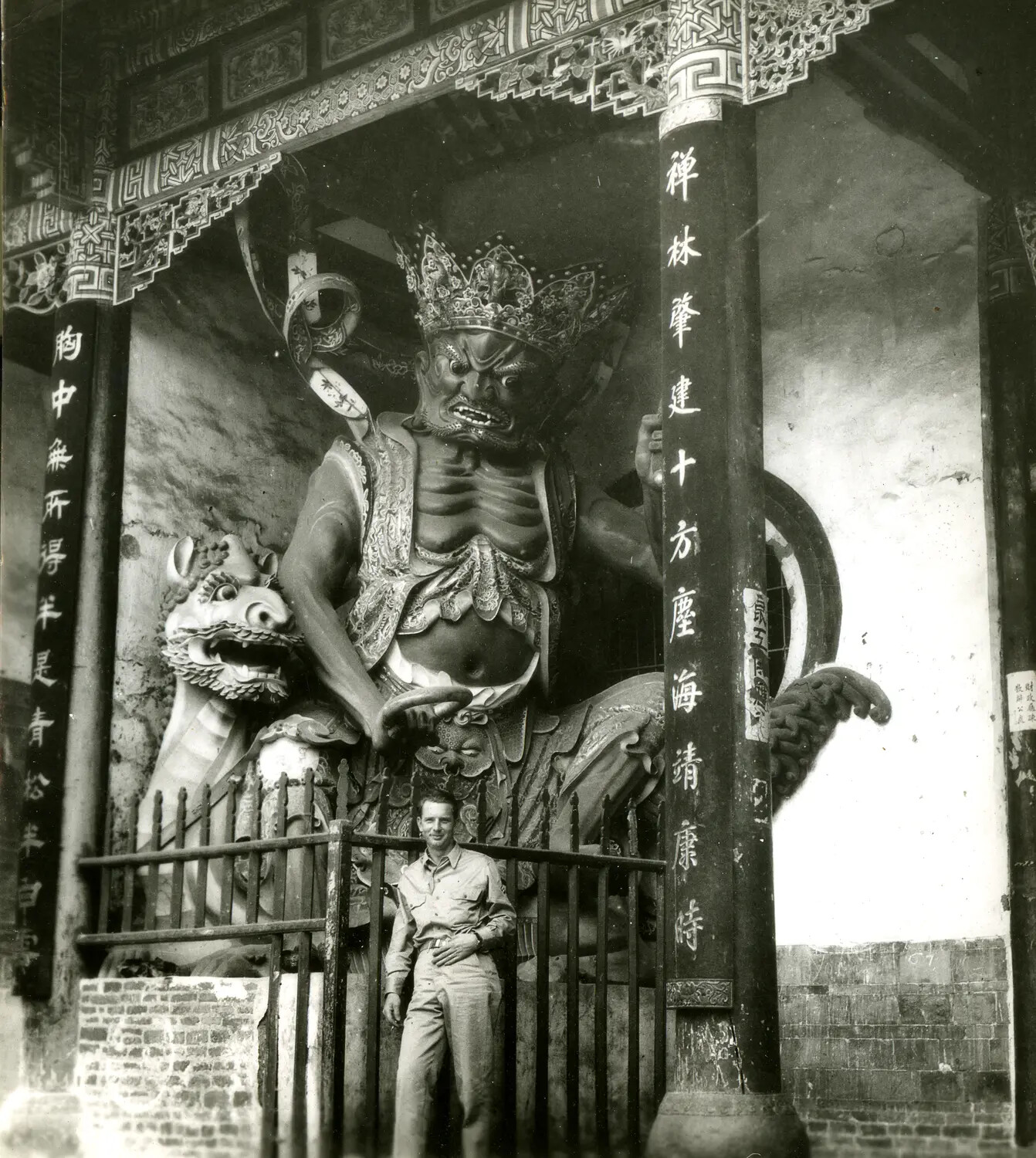 American Serviceman at Chinese Temple Guardian Statue, WWII China-Burma-India Theater