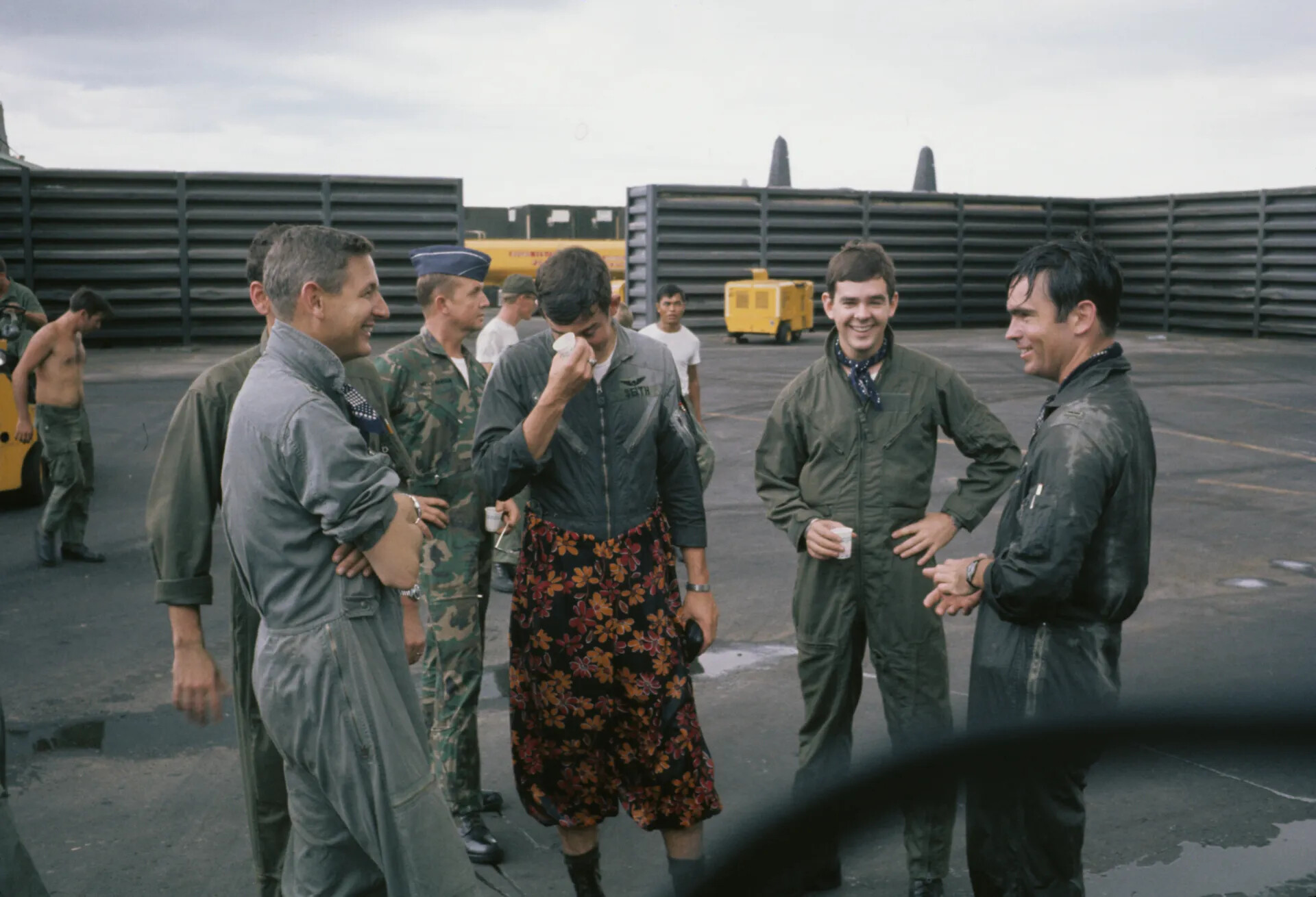 USAF Aircrew Celebrating Post-Mission Ritual on Flight Line, Southeast Asia Airbase, Vietnam War Era