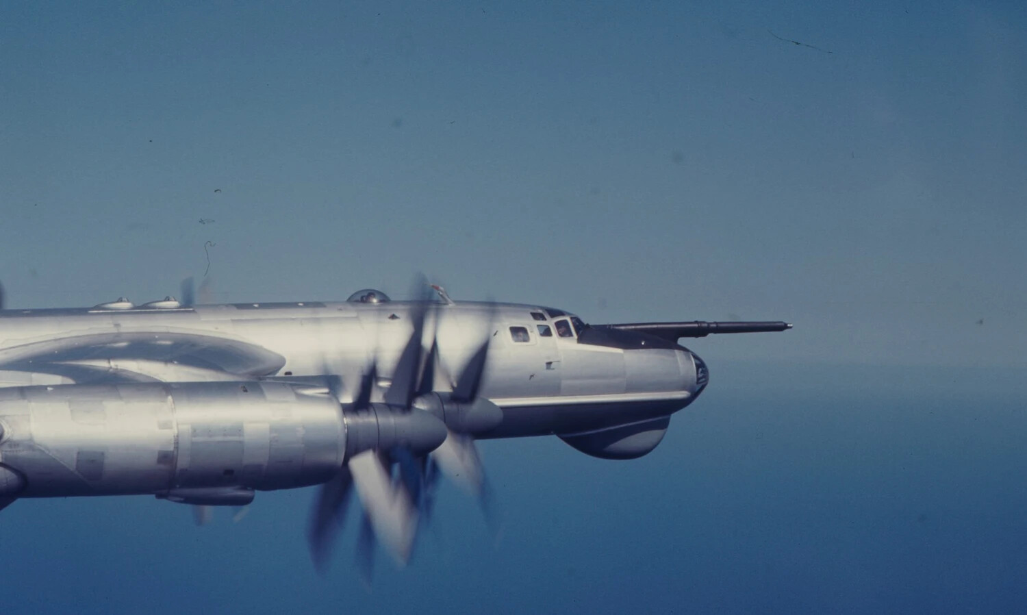 Air-to-Air View of Four-Engine Boeing-Derivative Military Aircraft with Nose Boom, Vietnam War Era