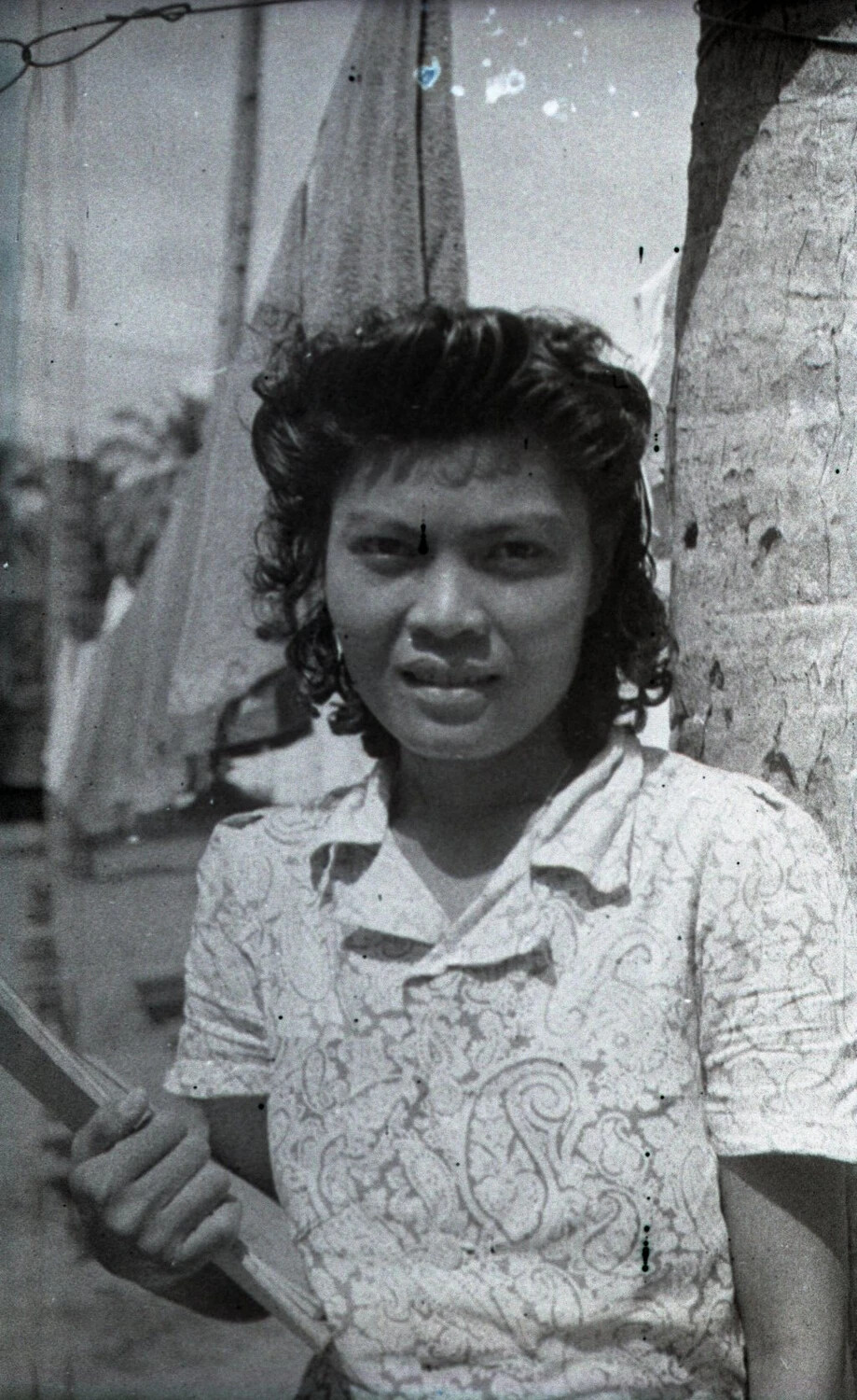 Filipino Woman with Pole Beside Palm Tree, Luzon, Philippines, WWII Era