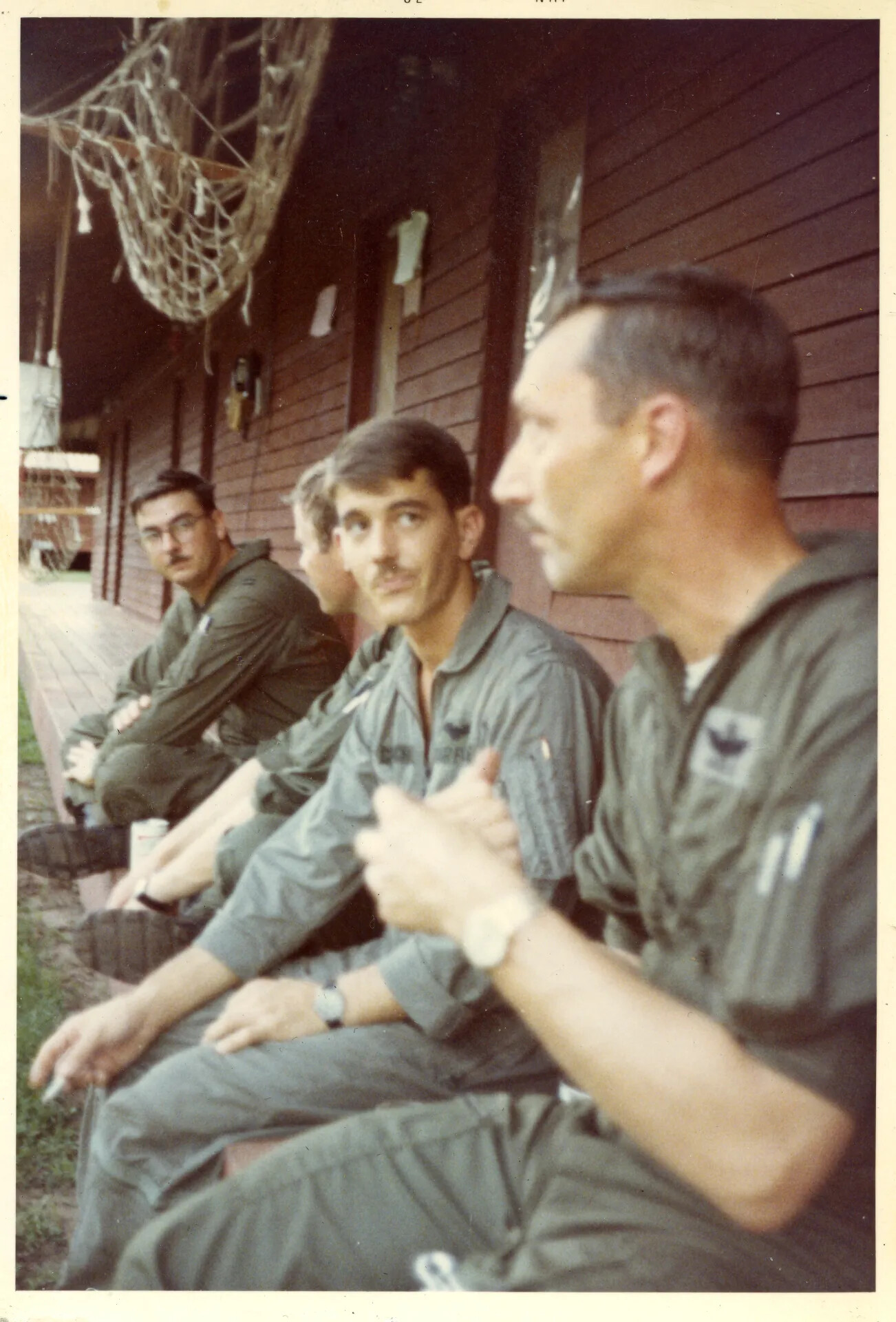 Row of USAF Pilots in Flight Suits on Barracks Porch, NKP RTAFB, June 1970