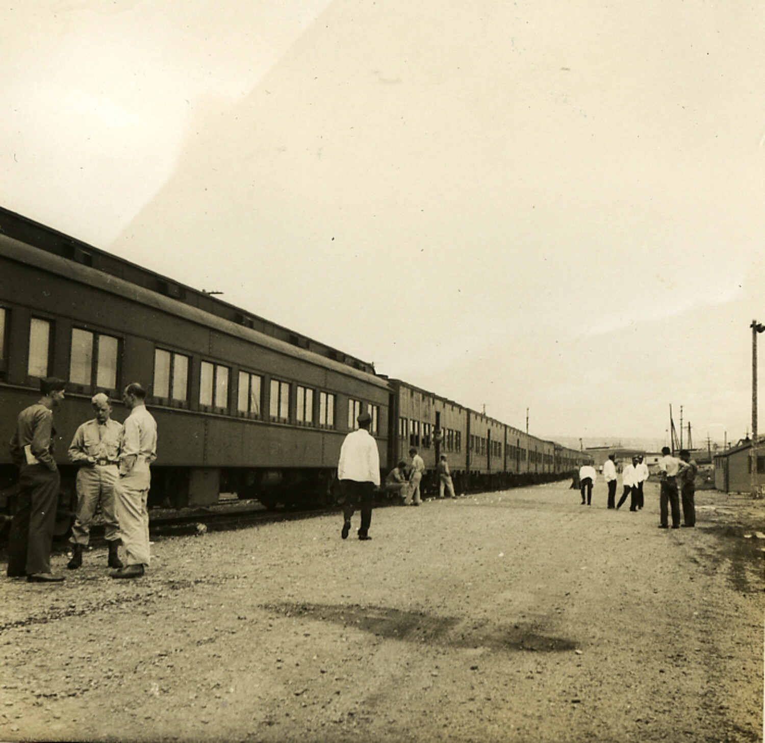 American Servicemen and Japanese Civilians at Railway Platform, Occupied Japan, 1950s