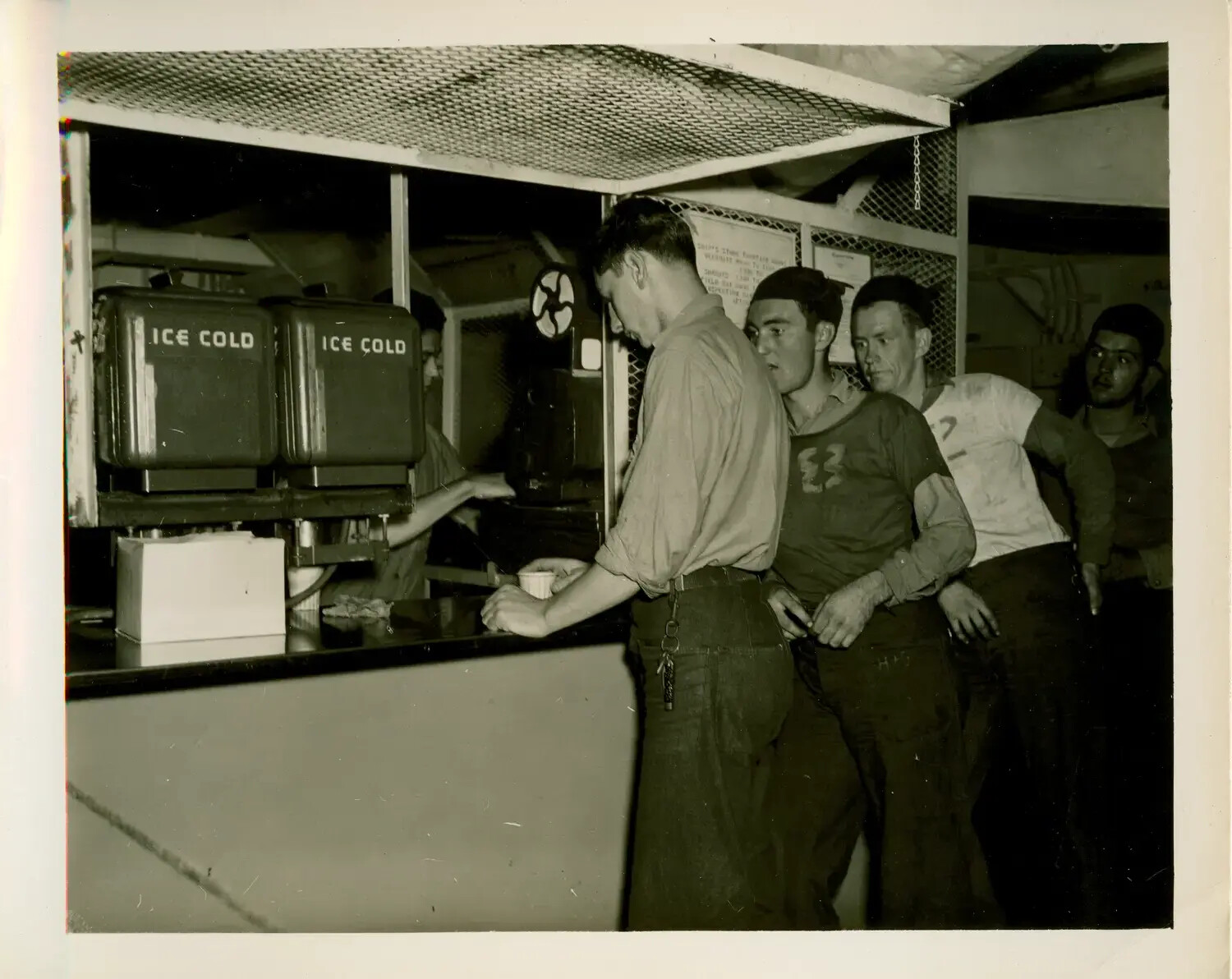 Sailors at the Ship's Store Soda Fountain Aboard USS Petrof Bay (CVE-80), World War II