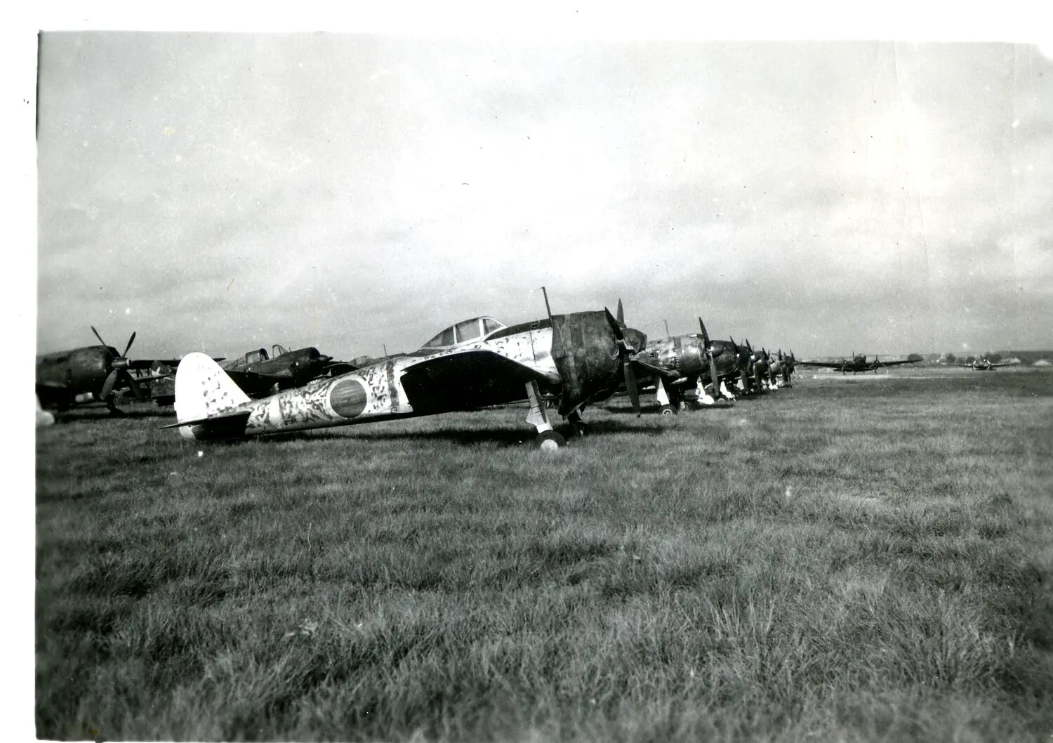 Row of Japanese Military Aircraft on Airfield, China-Burma-India Theater