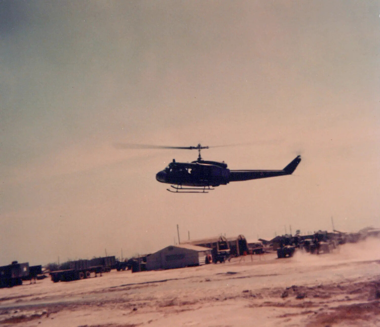 UH-1 Huey Helicopter in Flight over Cu Chi Base Camp, South Vietnam, 1967