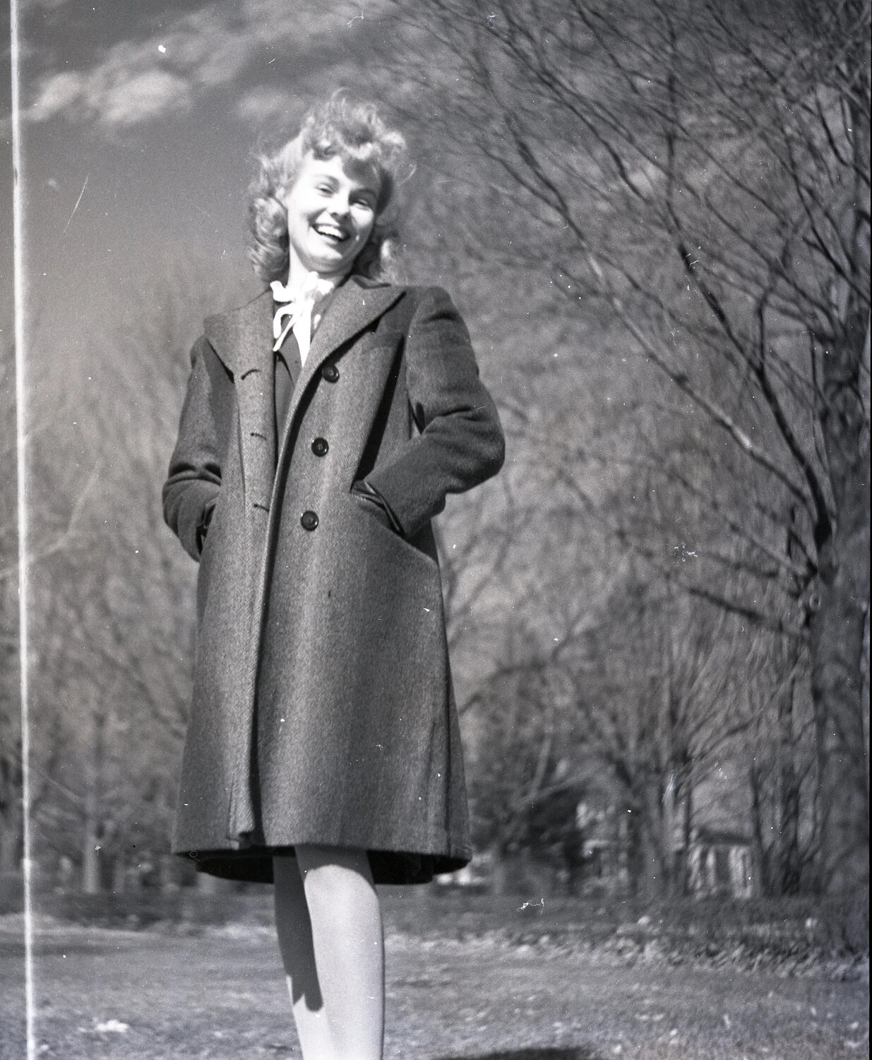 Portrait of a Young Woman Laughing Outdoors, Wool Coat