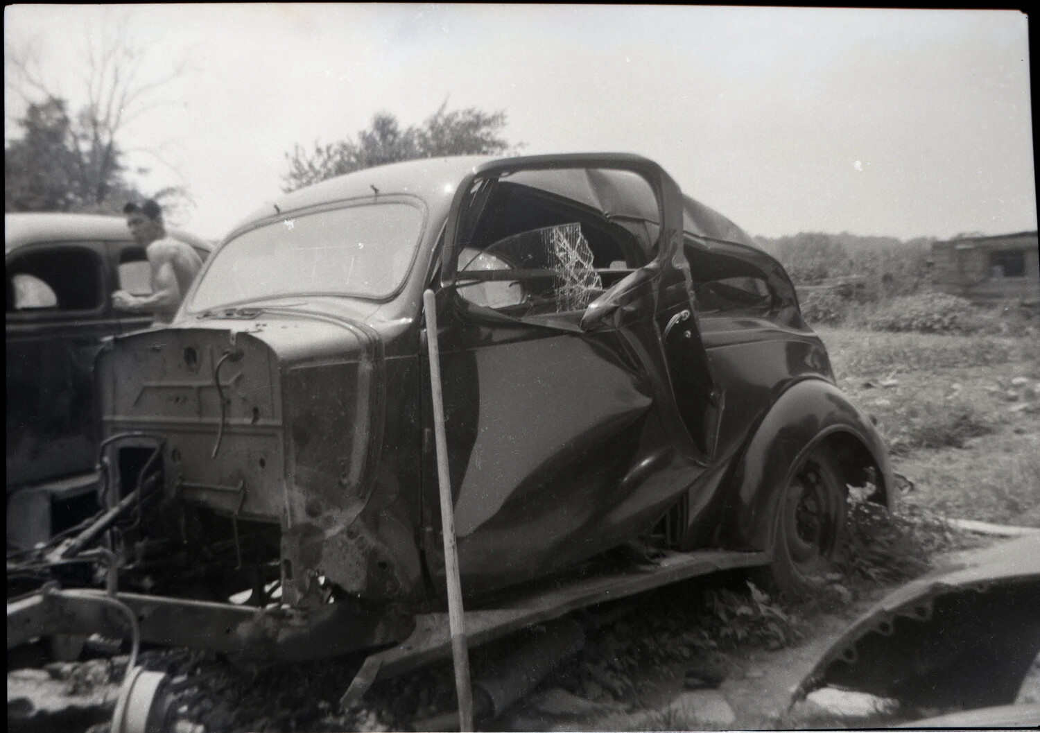 Wrecked 1930s Coupe in Rural Salvage Yard, Side View
