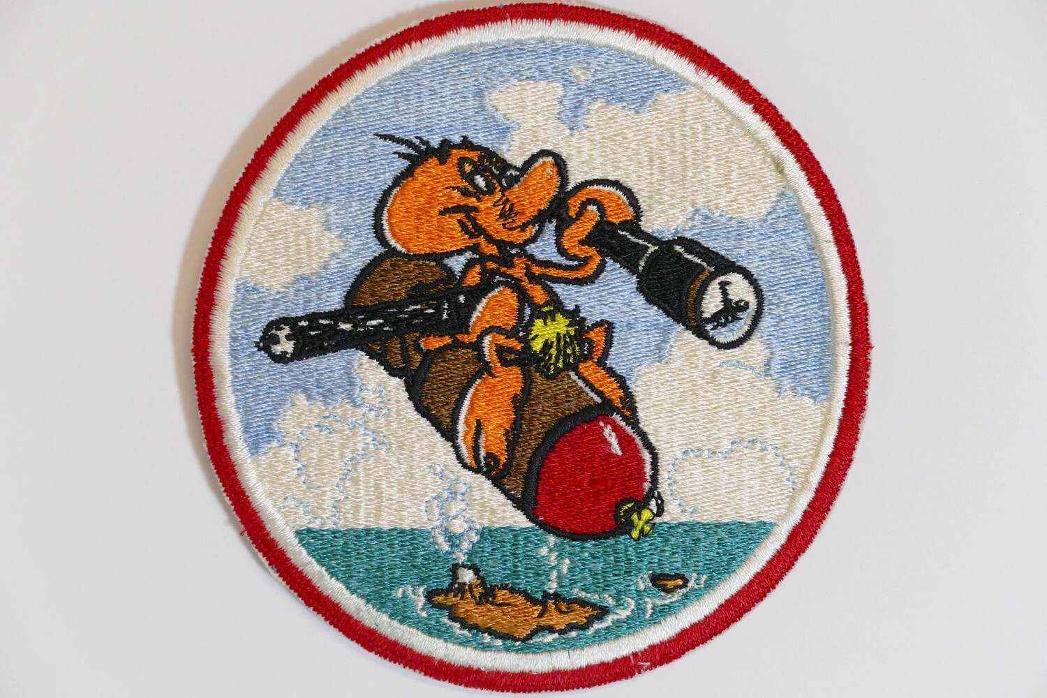 Embroidered Squadron Insignia Patch — Cartoon Gremlin Riding Falling Bomb with Rifle and Telescope, U.S. Navy, Korean War Era