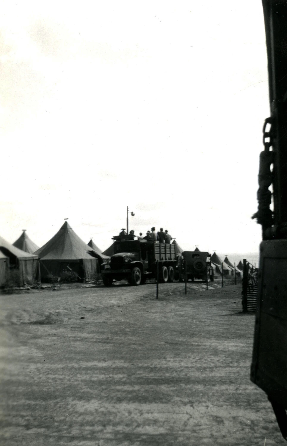 Camp Street with Loaded Military Truck and Tent Rows, WWII Pacific Theater