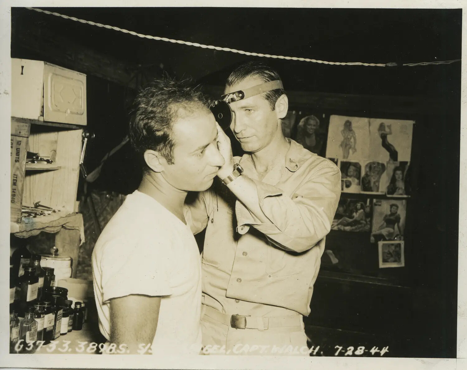 Flight Surgeon Capt. Walch Examining Serviceman, 389th Bomb Squadron, 312th Bomb Group, 28 July 1944