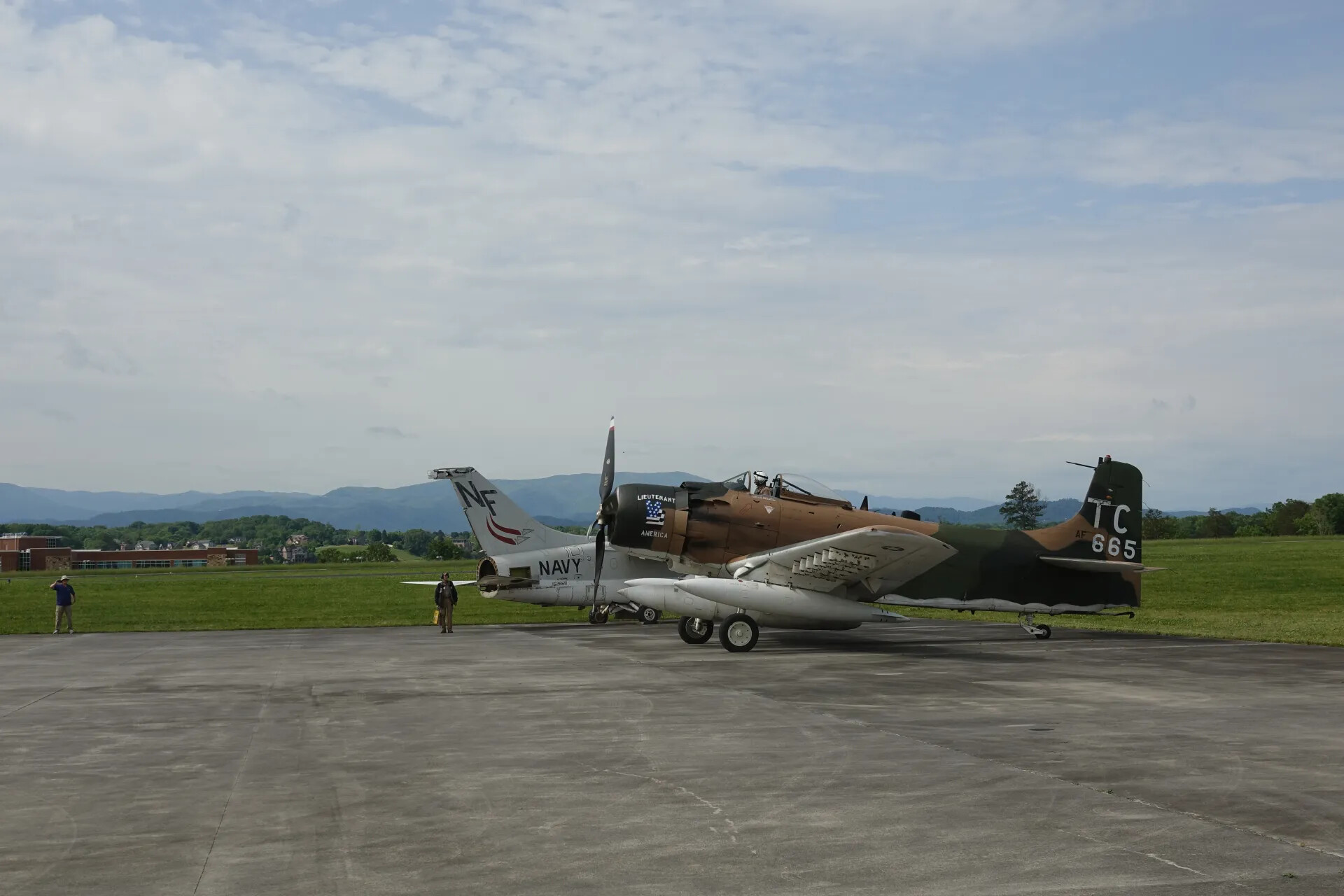 Two Douglas A-1 Skyraiders (Air Force 'TC 665' Lieutenant America and Navy 'NF' Tail Code) at Airshow Event, May 2019