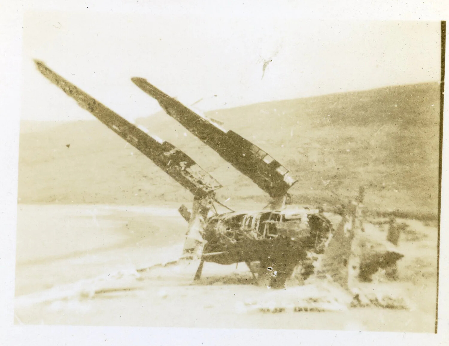 Crashed Twin-Engine Aircraft Wreckage Near Shoreline, Aleutian Islands, World War II