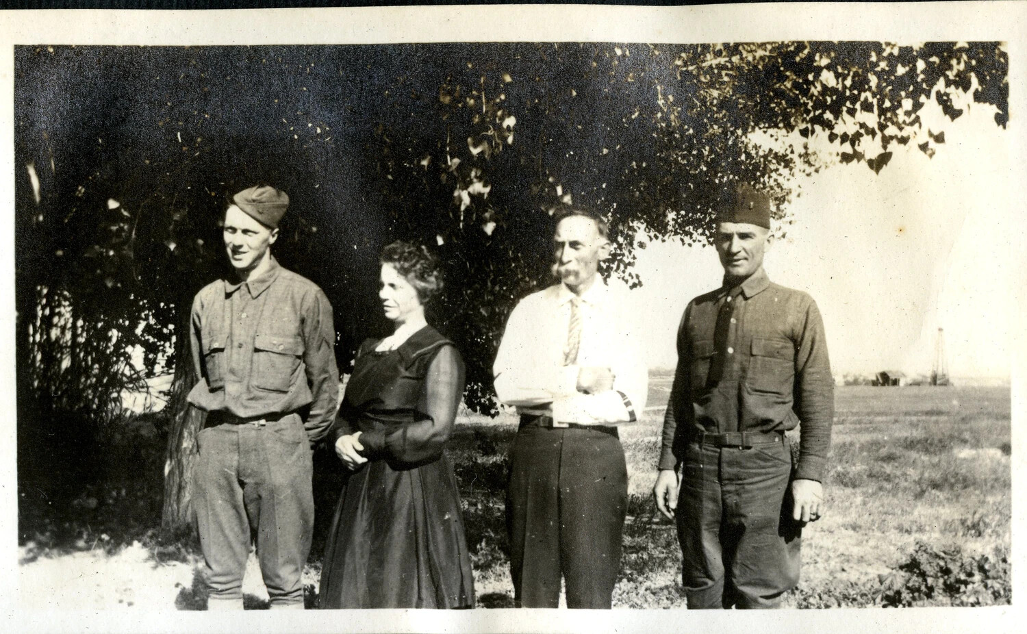 Family Group Portrait with Two Uniformed Soldiers, WWI-Era Photo Album