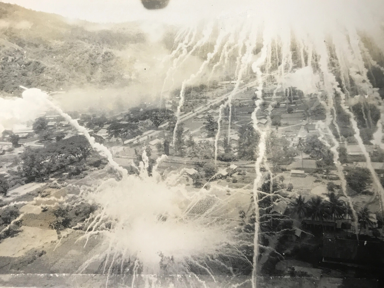Low-Level Strike Photograph: 312th Bomb Group Aircraft Attacking a Pacific Village, WWII