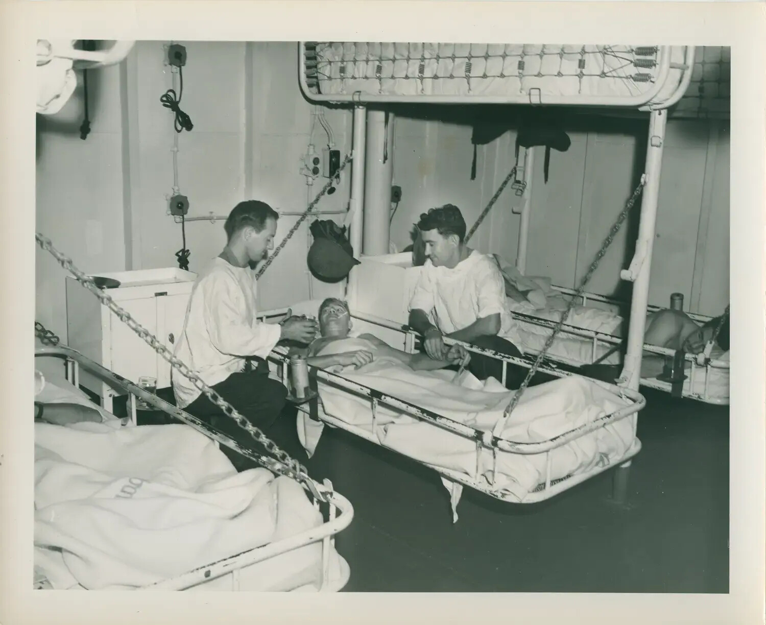 Wounded Sailor Attended in Sick Bay, USS Petrof Bay (CVE-80)