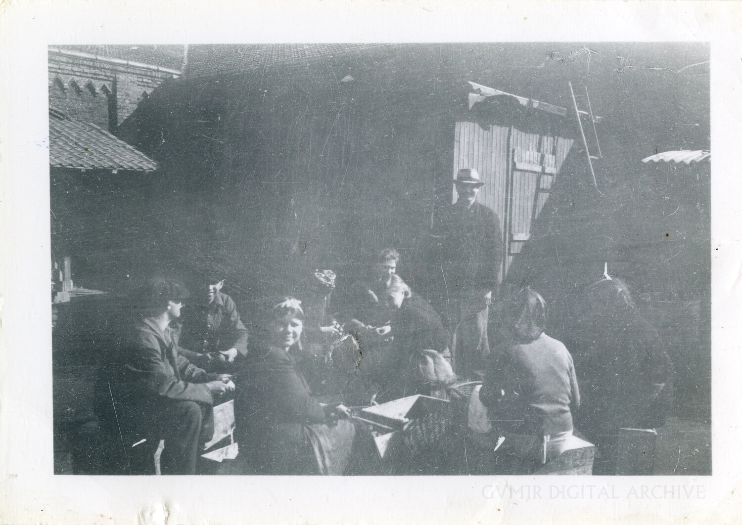 American Paratroopers Fraternizing with French Civilians in a Farmyard, WWII European Theater