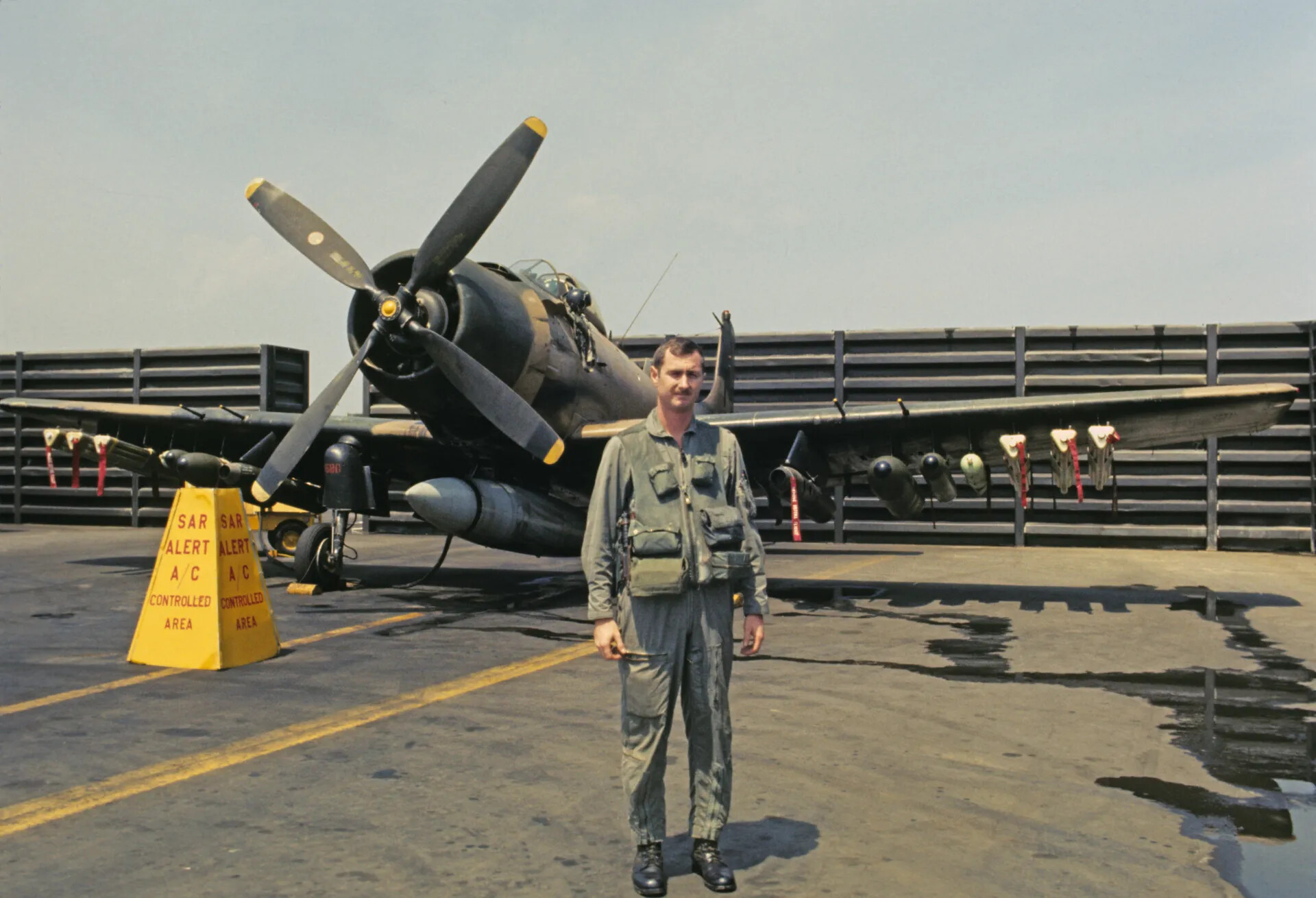 Pilot in Front of SAR-Alert Douglas A-1 Skyraider on a Carrier Flight Deck — Don Engebretsen Slide Collection