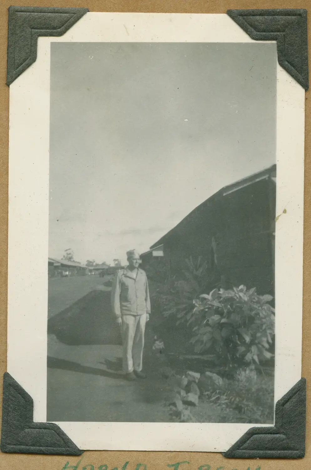 Soldier Standing Beside Quonset-Type Building, Hawaii, WWII Era