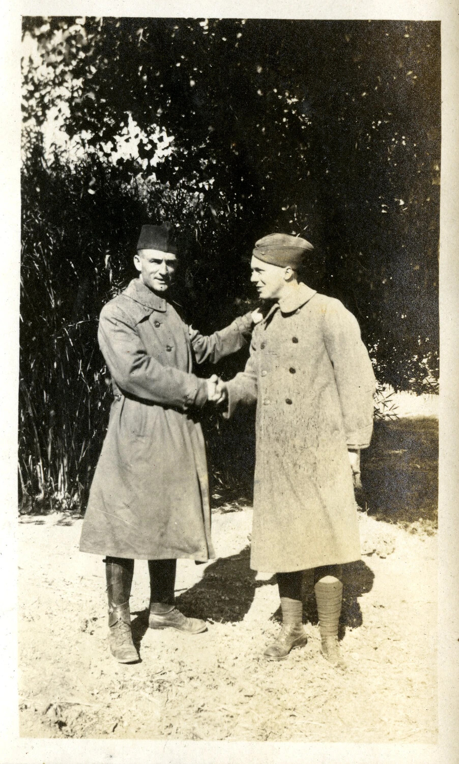 Two Soldiers Shaking Hands in Wool Overcoats, WWI Era, 1917-1918
