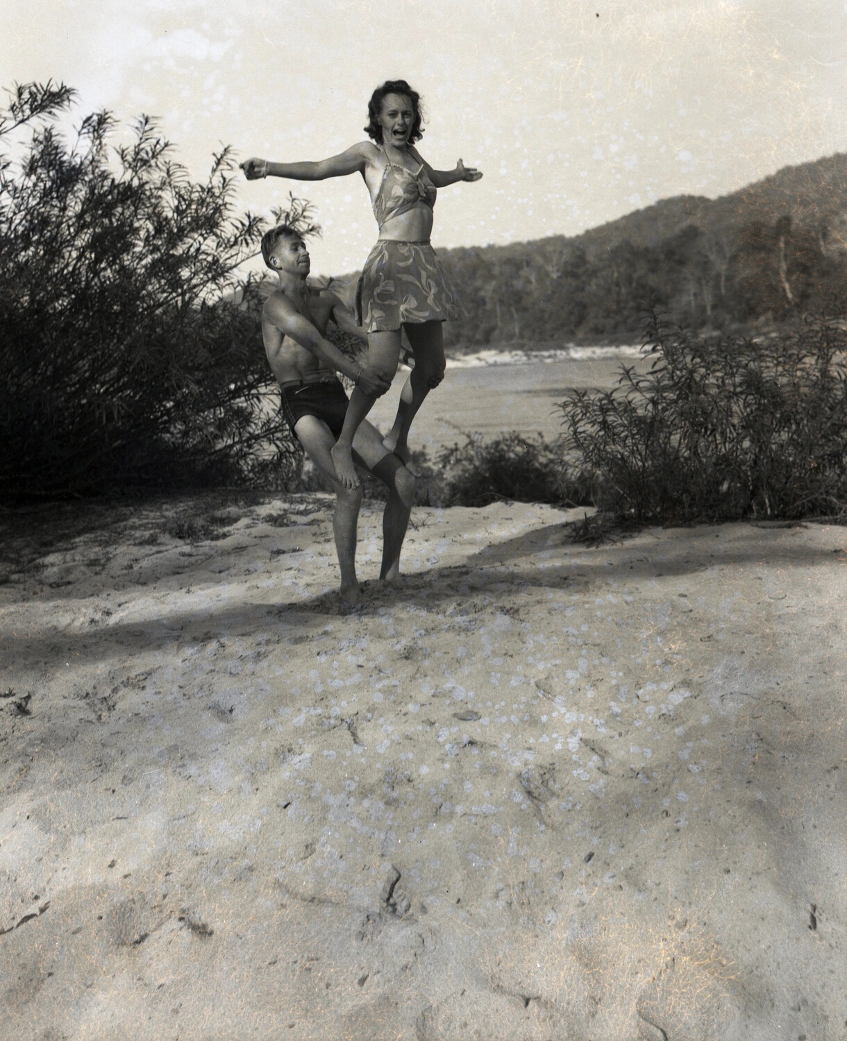 Informal Beach Snapshot, Man and Woman Posing Playfully — WWII-Era Personal Photograph