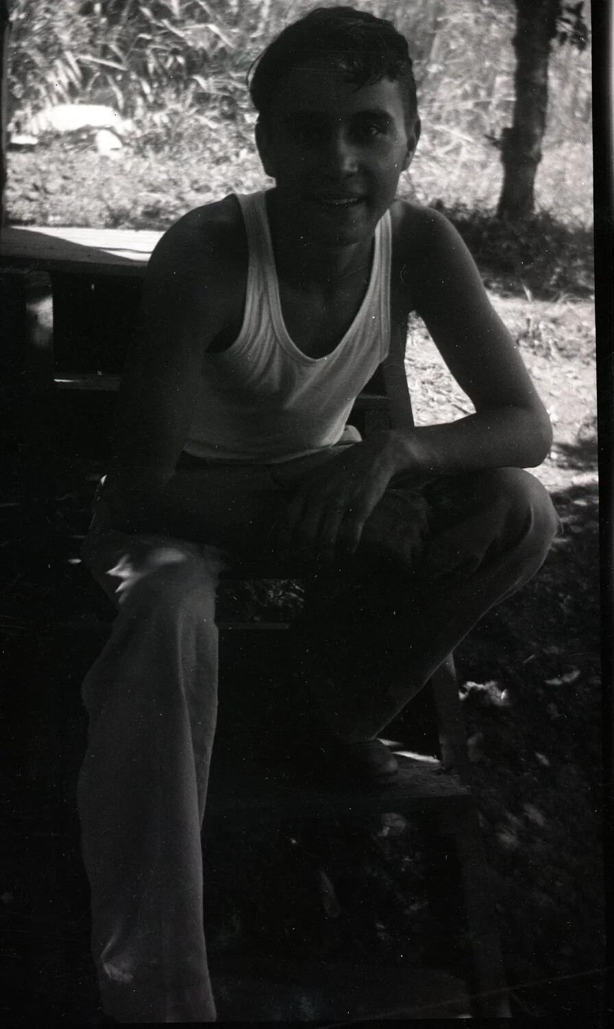 Serviceman in Undershirt at Tropical Encampment, Jack T. Kelley Album