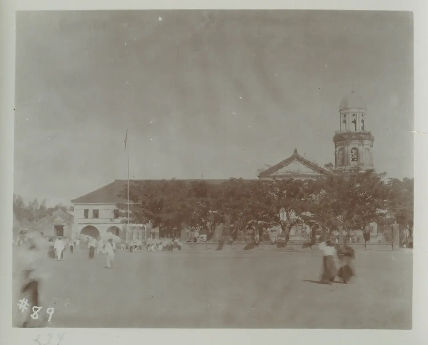 Town Plaza with American Flag, Government Building, and Church Dome, Philippines, c. 1890s-1900s