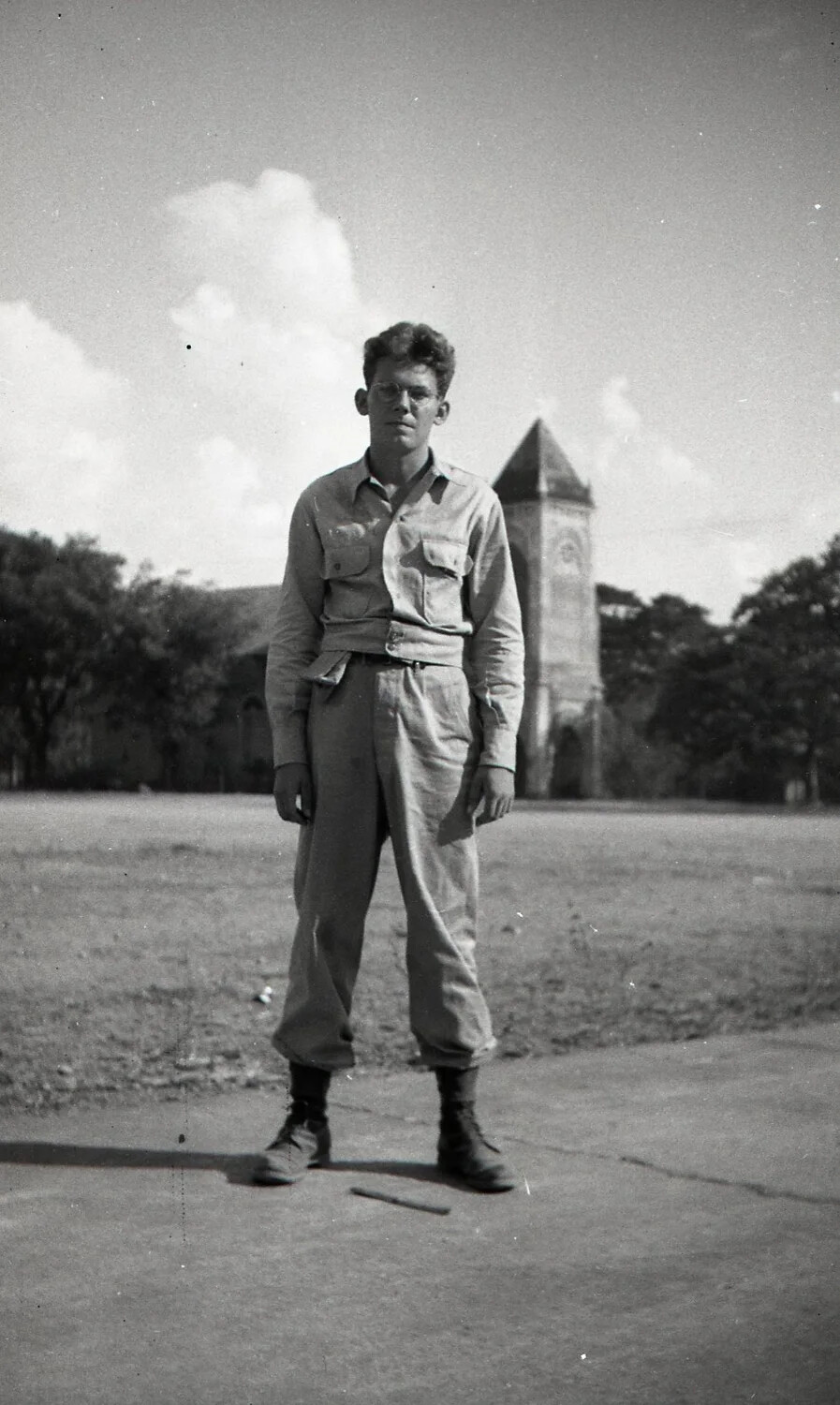 American Serviceman Portrait Before Institutional Tower, Luzon, Philippines, WWII Era
