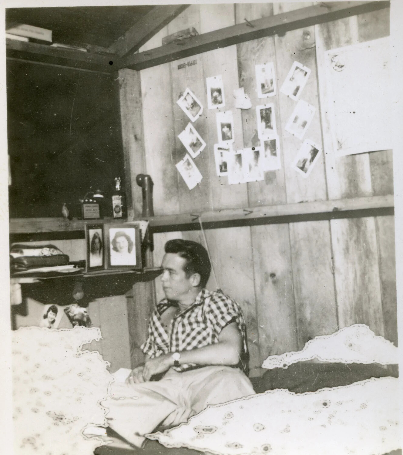 Serviceman in Barracks Room with Photo Collage Wall, World War II