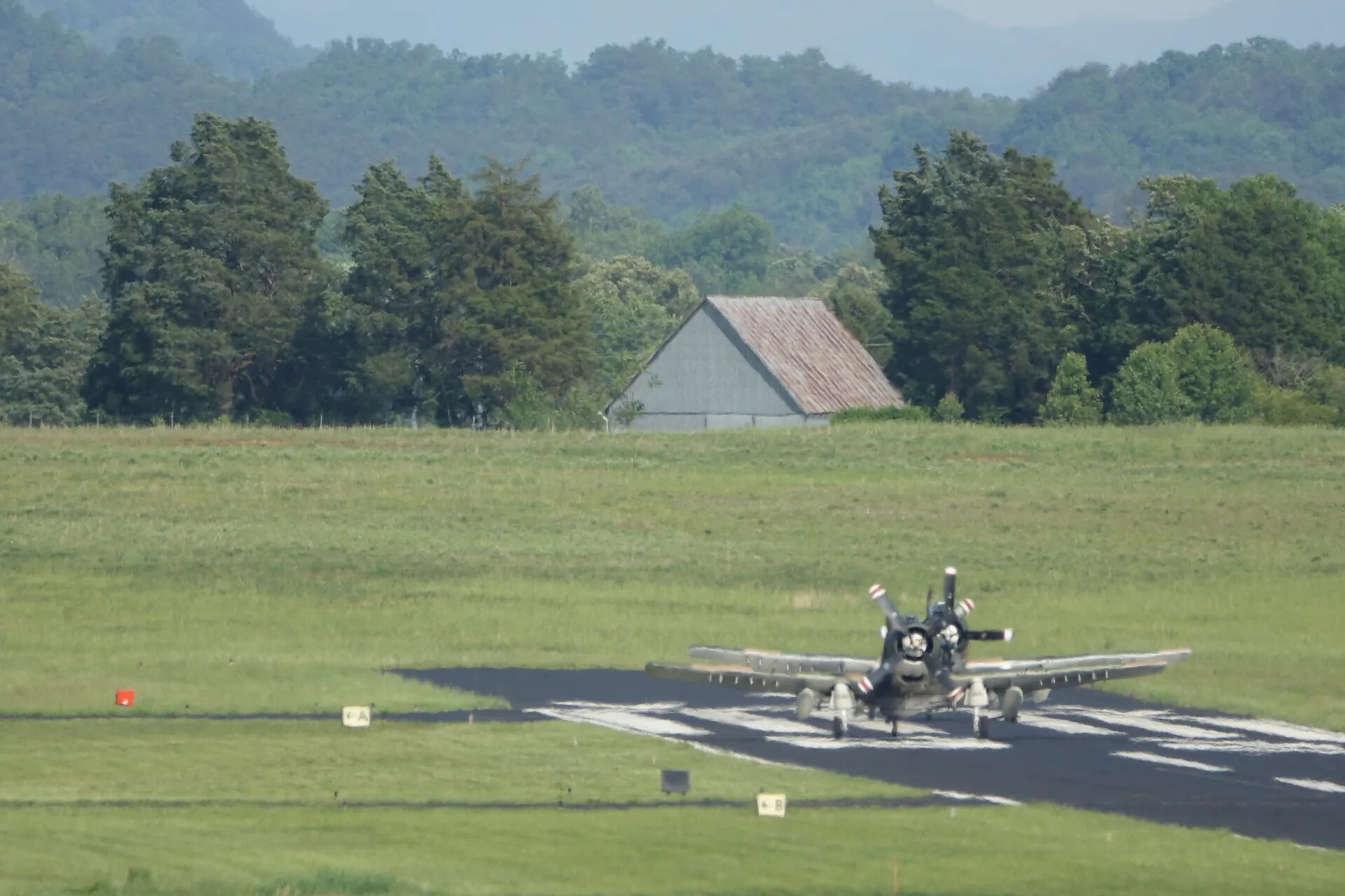 Two A-1 Skyraiders Taxiing at Reunion Fly-In, May 2019