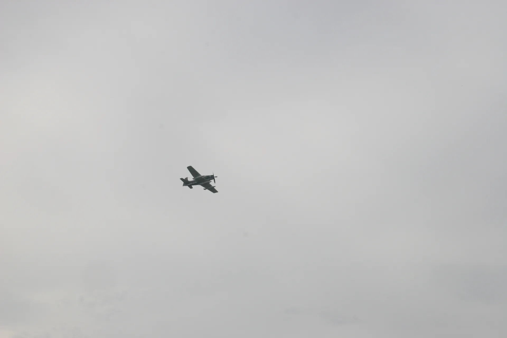 Aircraft Flyby Silhouette Against Overcast Sky, Third Frame