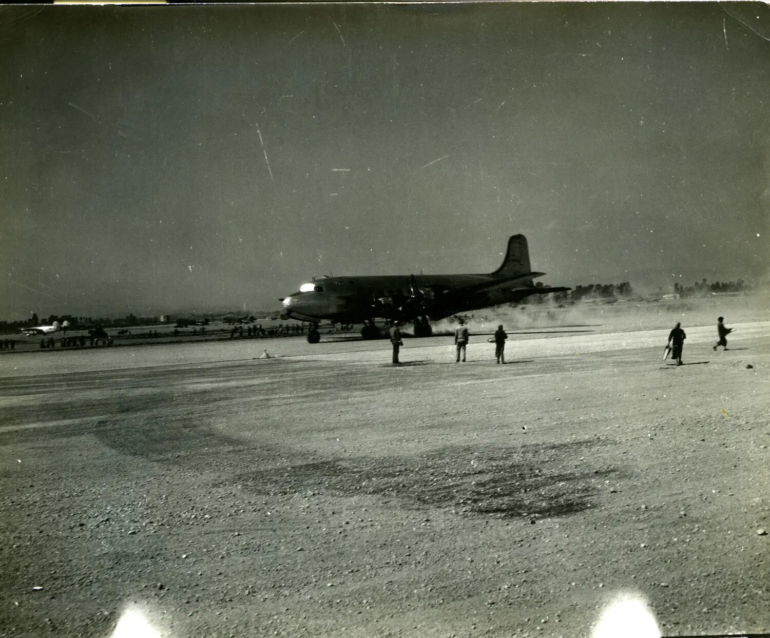 Four-Engine Transport Aircraft on Dusty Airfield, China-Burma-India Theater, WWII
