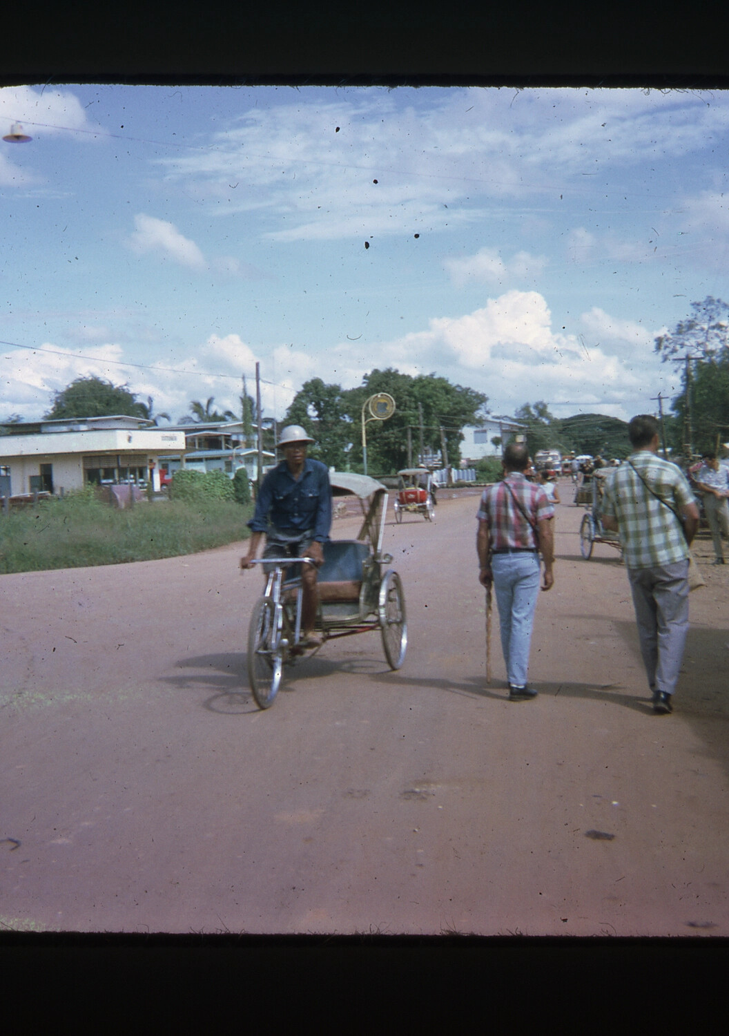Cyclo Driver and Pedestrians on a Vietnamese Town Street, Vietnam War Era (35mm Slide)