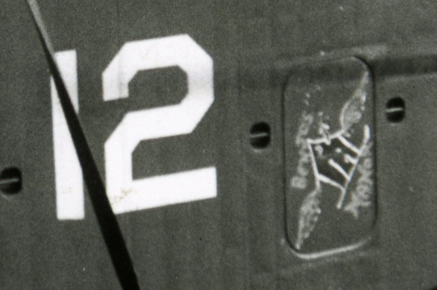 Aircraft Fuselage Detail with Stencilled Number '12' and Data Plate, Korean War Era