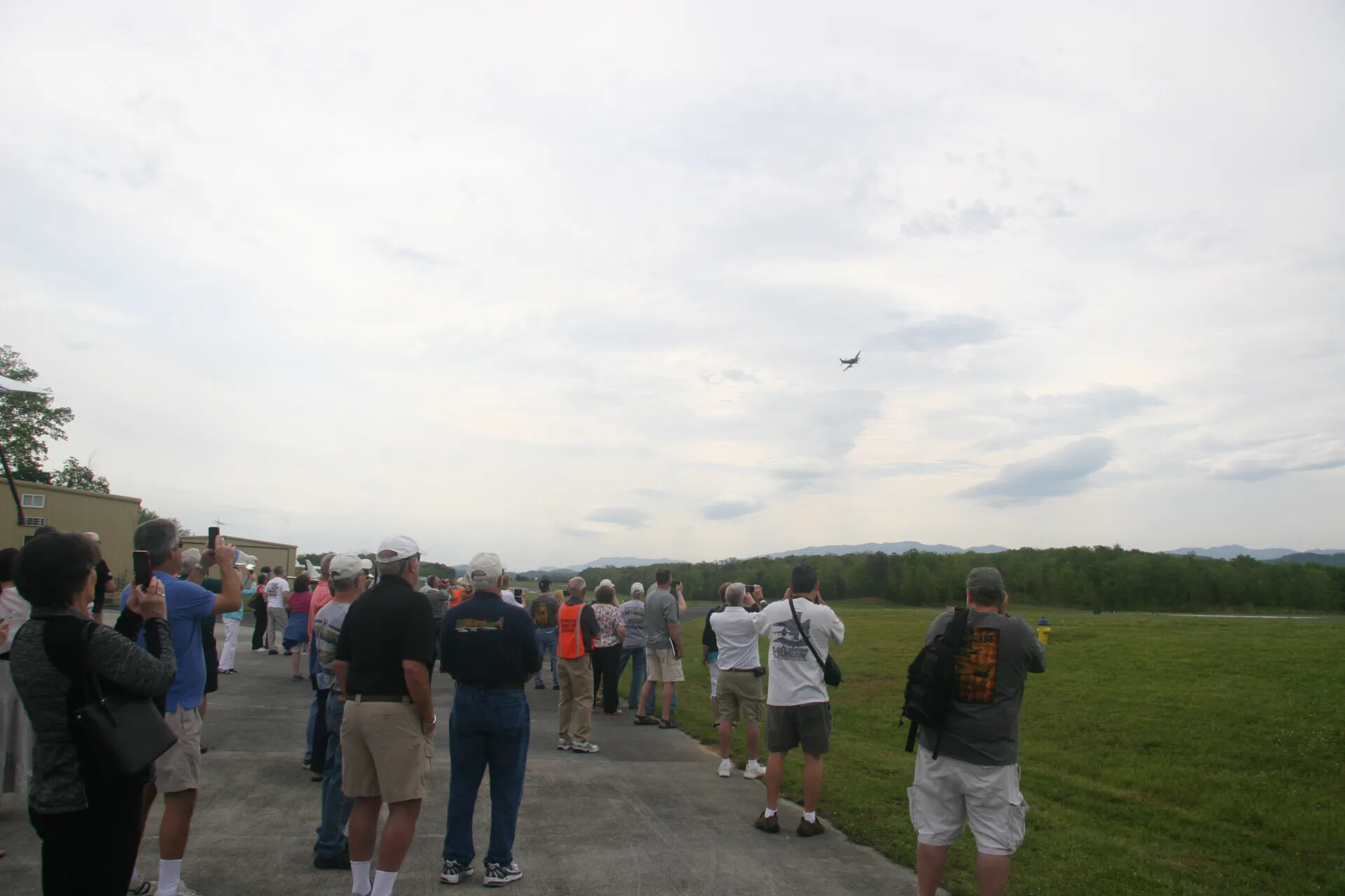 Spectators Photographing a Flyover During an Operation Tailwind Commemorative Event, 30 April 2016