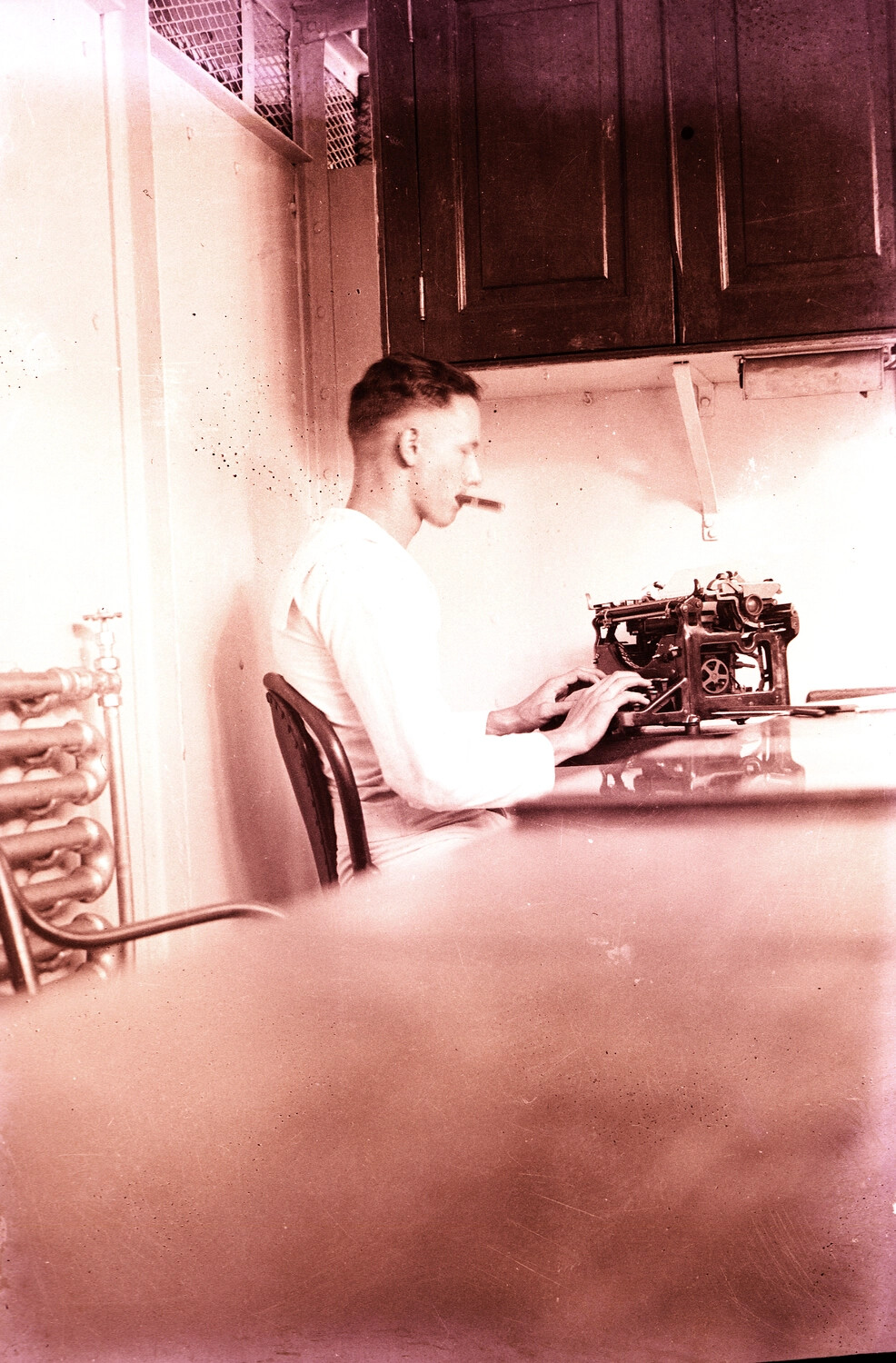 Sailor Typing at Shipboard Desk, U.S. Navy China Station, 1930s