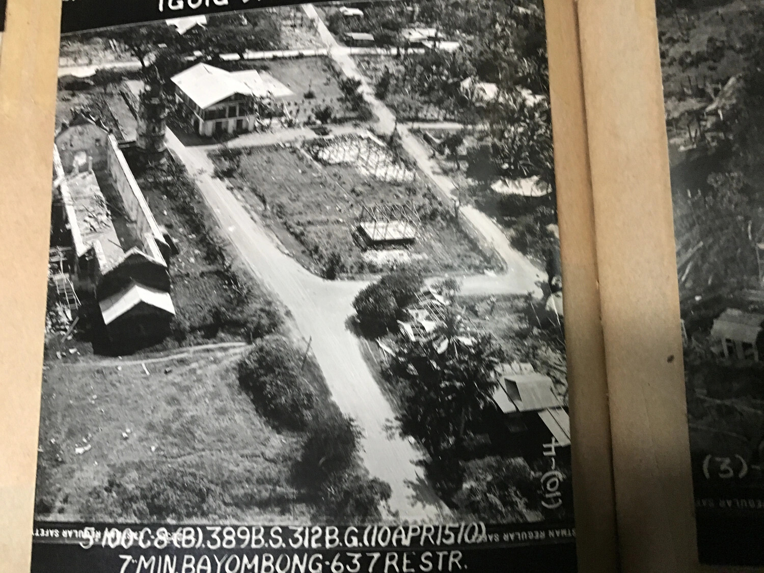 312th Bomb Group Strike Photograph — Bayombong, Luzon, Philippines, 10 April 1945 (Album Print)